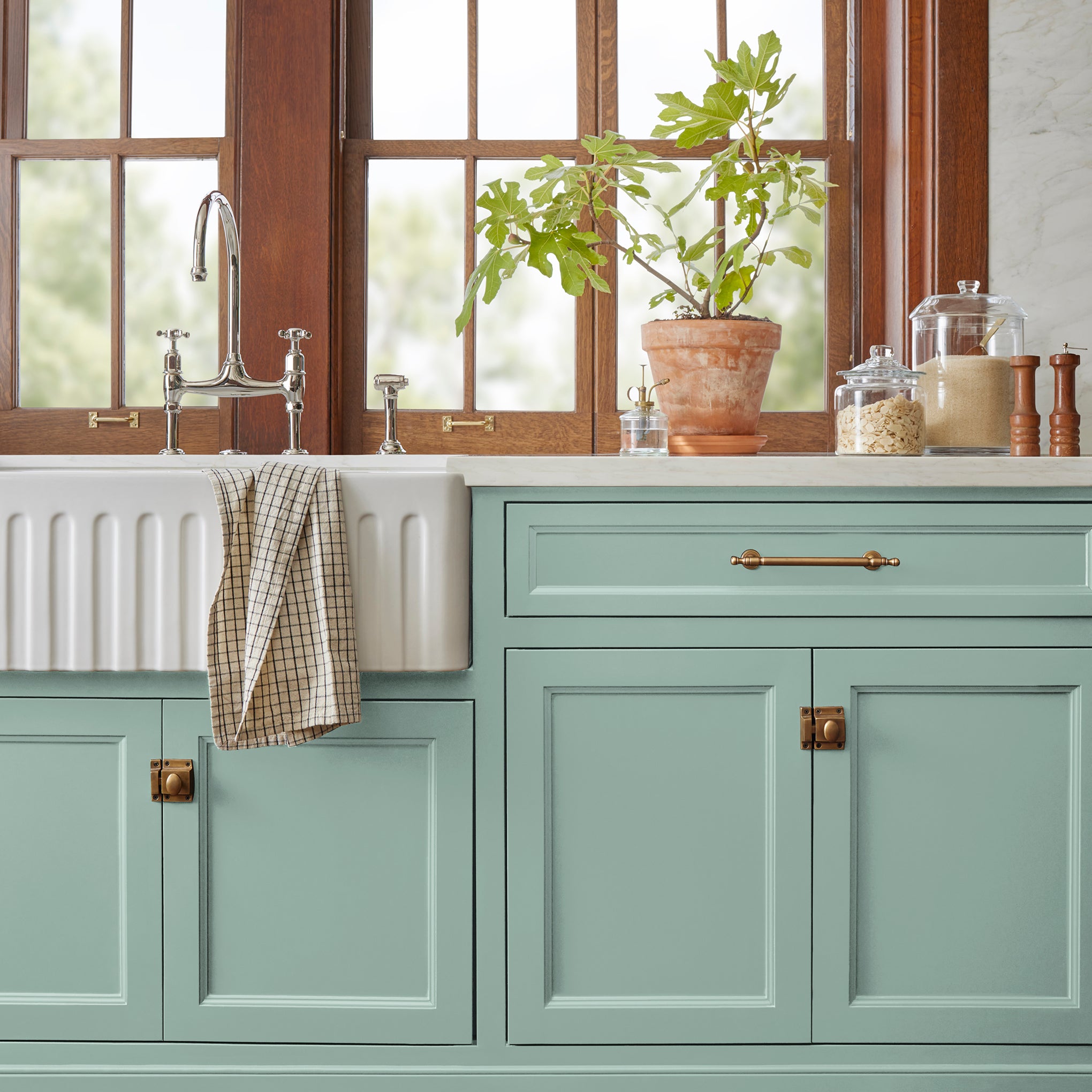 Aqua and minty blue slightly muted with gray door and cabinet paint named texas summer shown painted on kitchen cabinet  