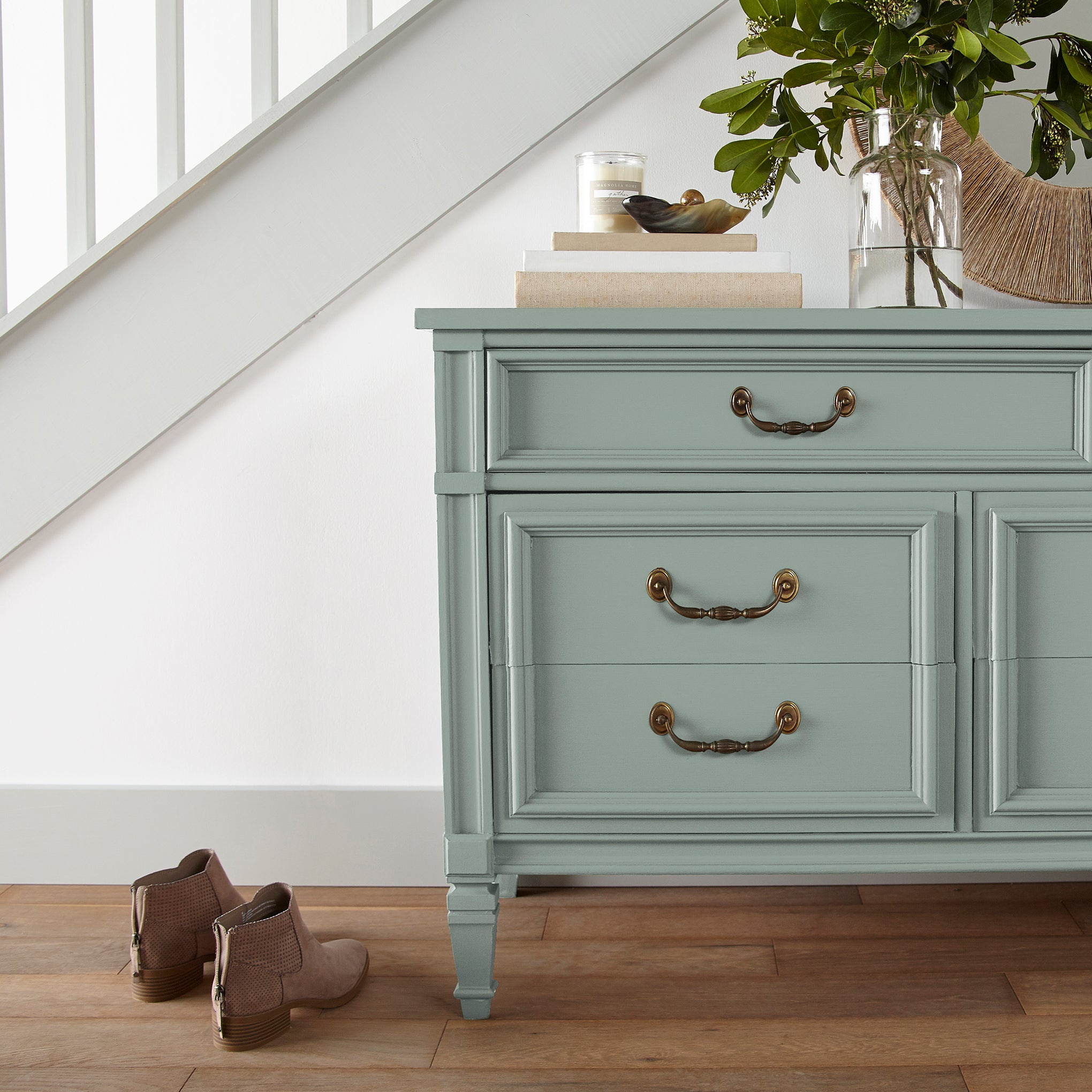 Washed mint green door and cabinet paint named local greenhouse shown painted on entryway cabinet