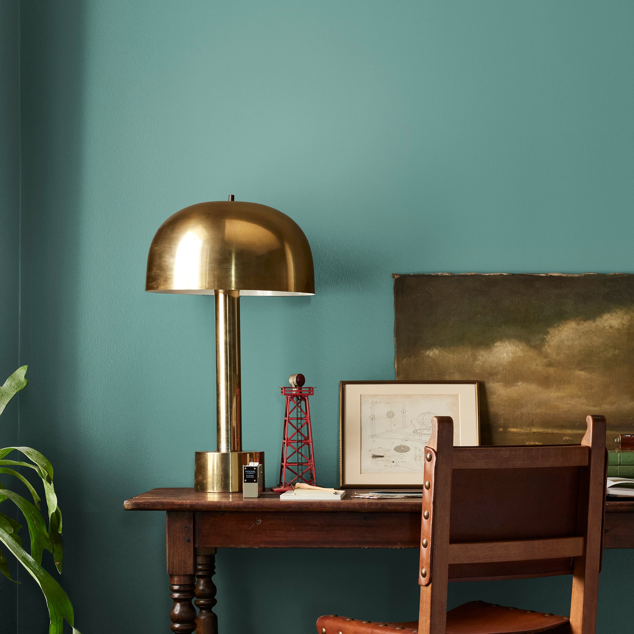 Dark aqua blue blended with a bit of ashy sage green interior paint named spontaneous shown painted on bedroom wall