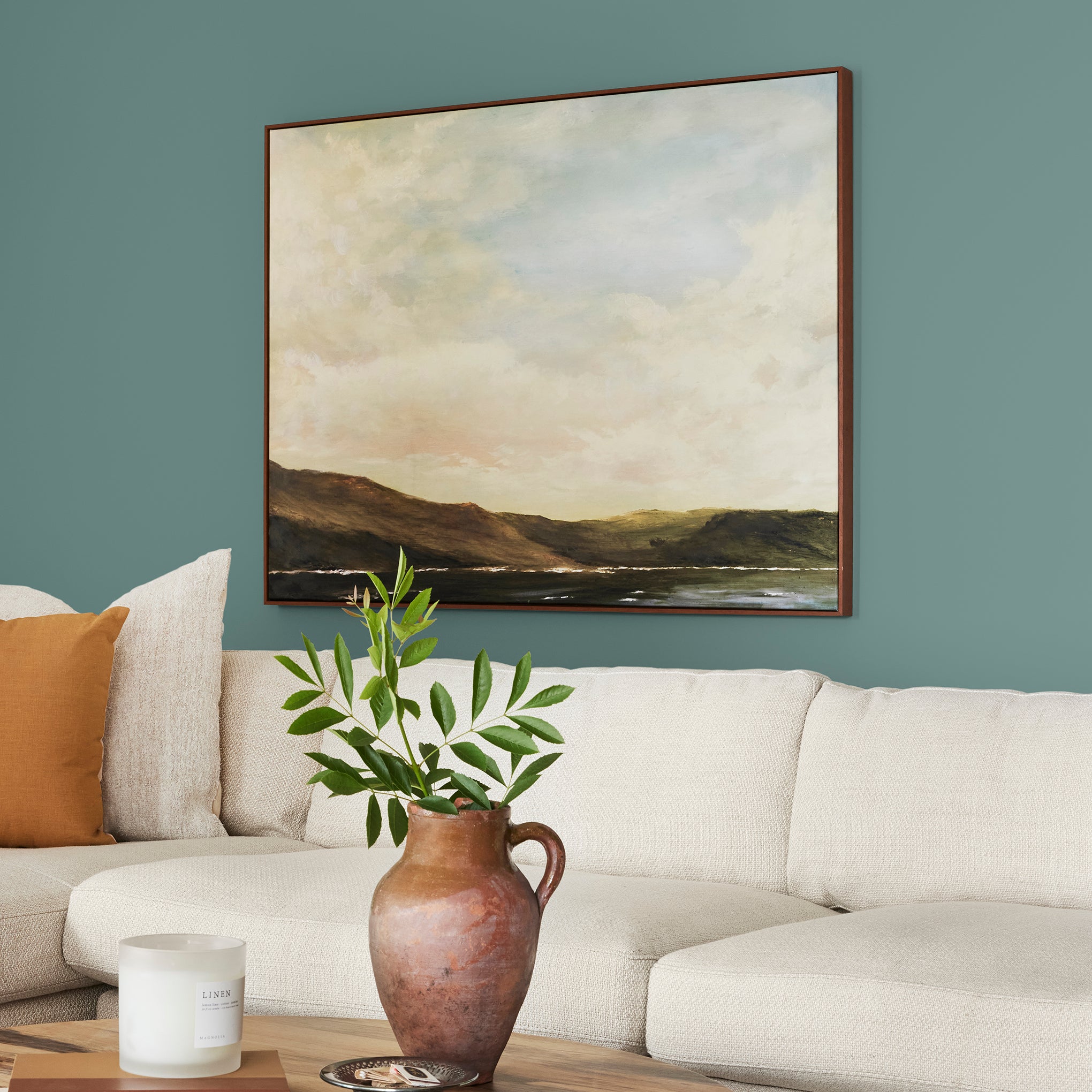 A dark, dusty aqua interior paint named tranquility shown painted on living room wall