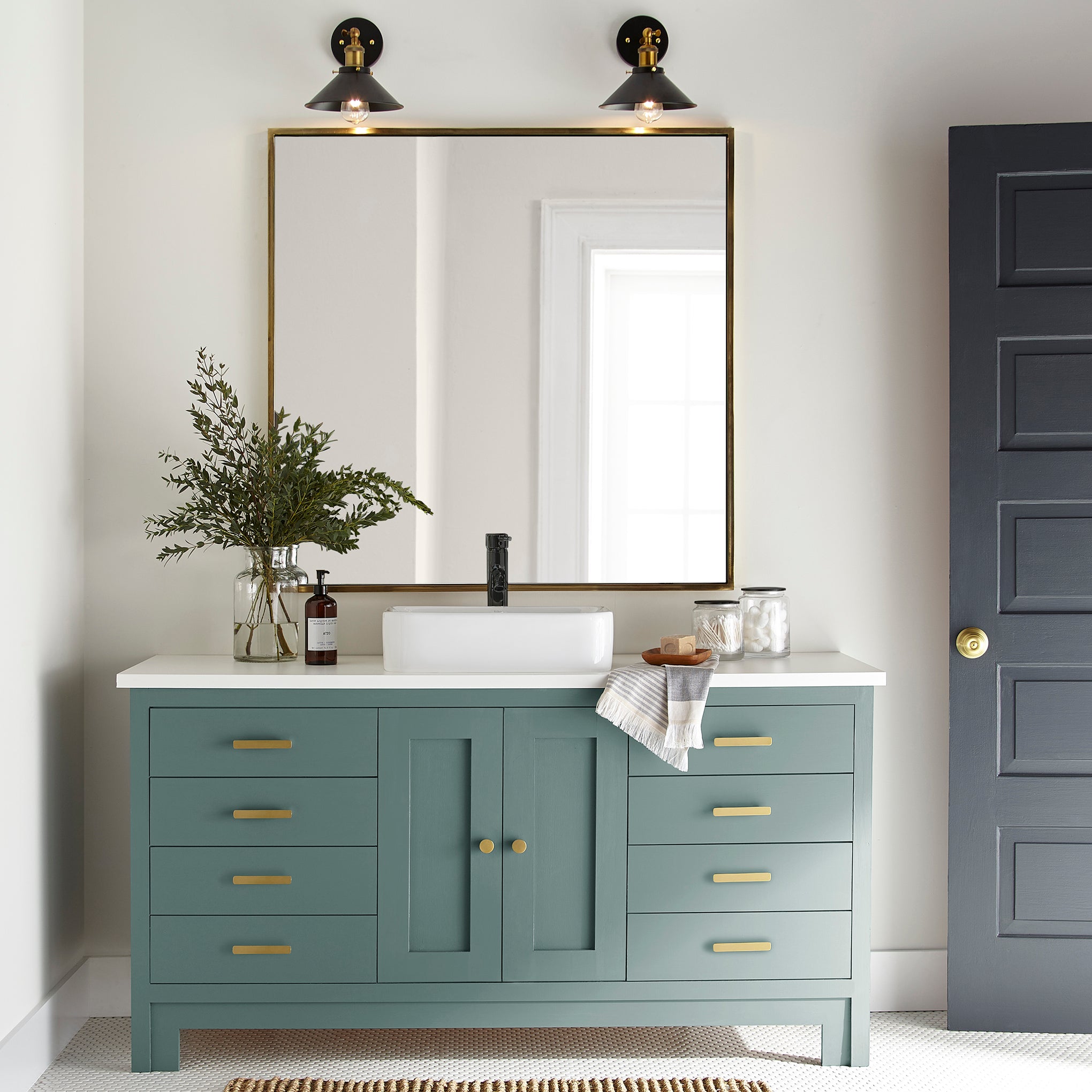 A dark, dusty aqua door and cabinet paint named tranquility shown painted on bathroom cabinet