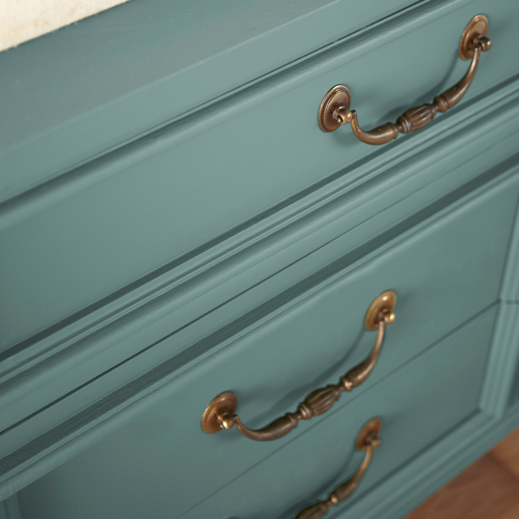 A dark, dusty aqua door and cabinet paint named tranquility shown painted on cabinet