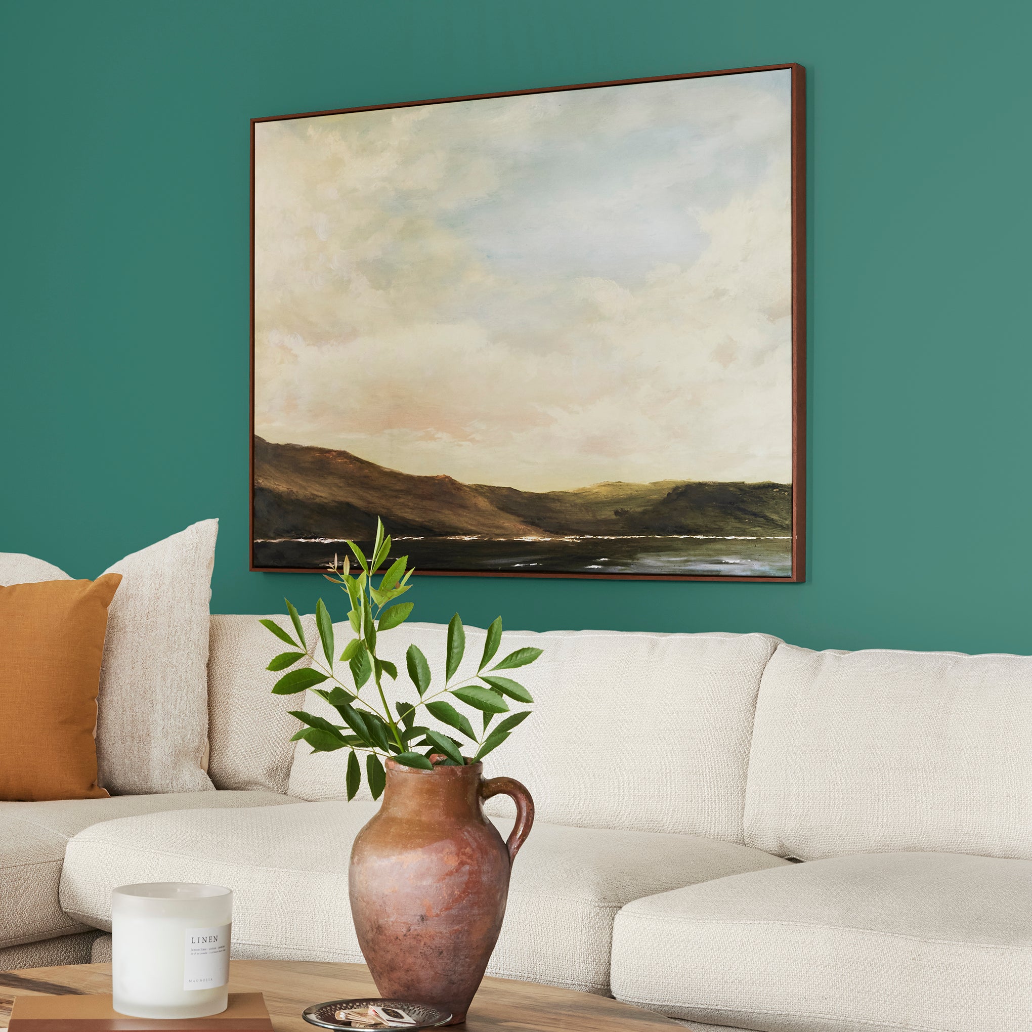 crisp hunter green with golden accents paint named aspen leaf shown painted on living room wall
