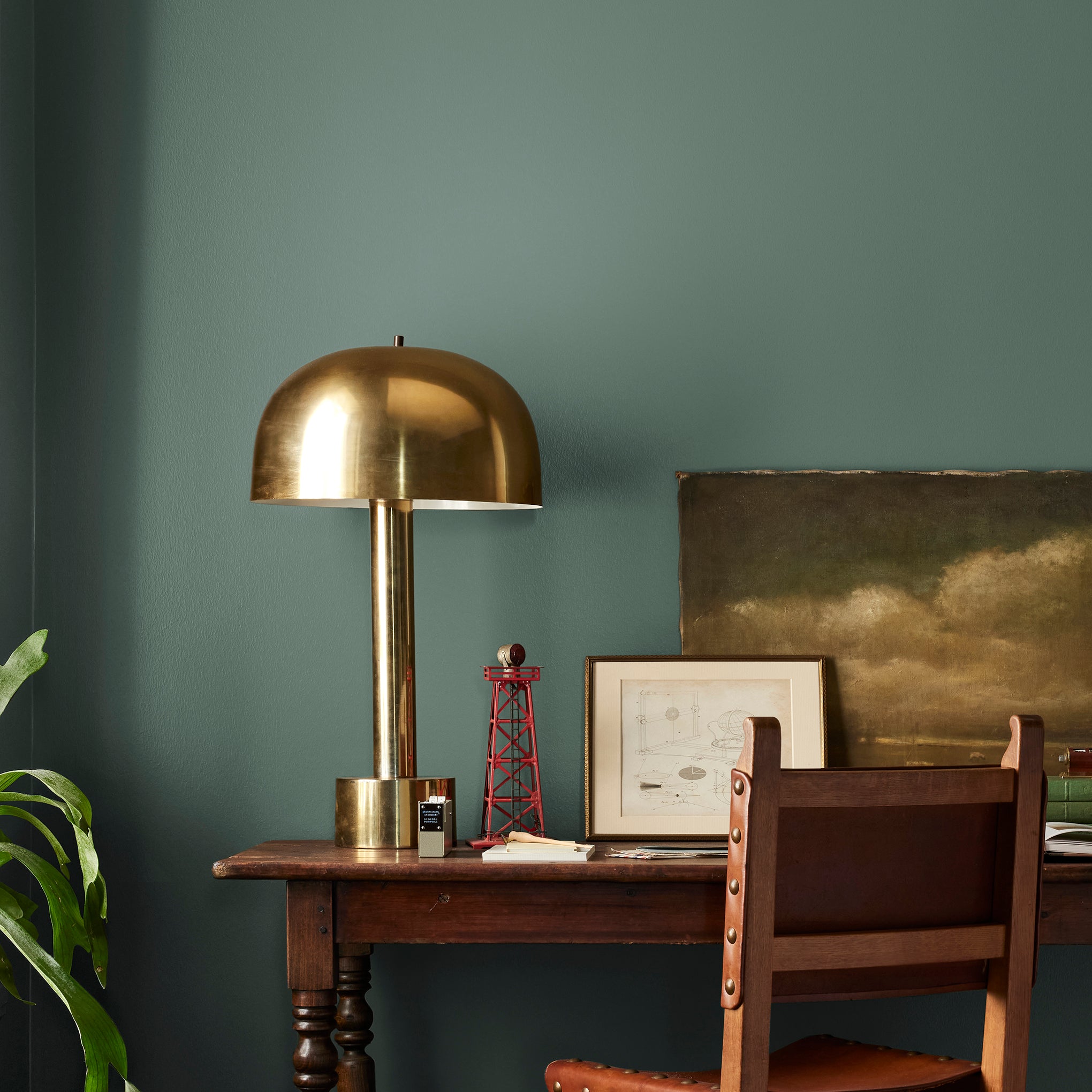 Deep hunter green interior paint named regal leaf shown painted on bedroom wall