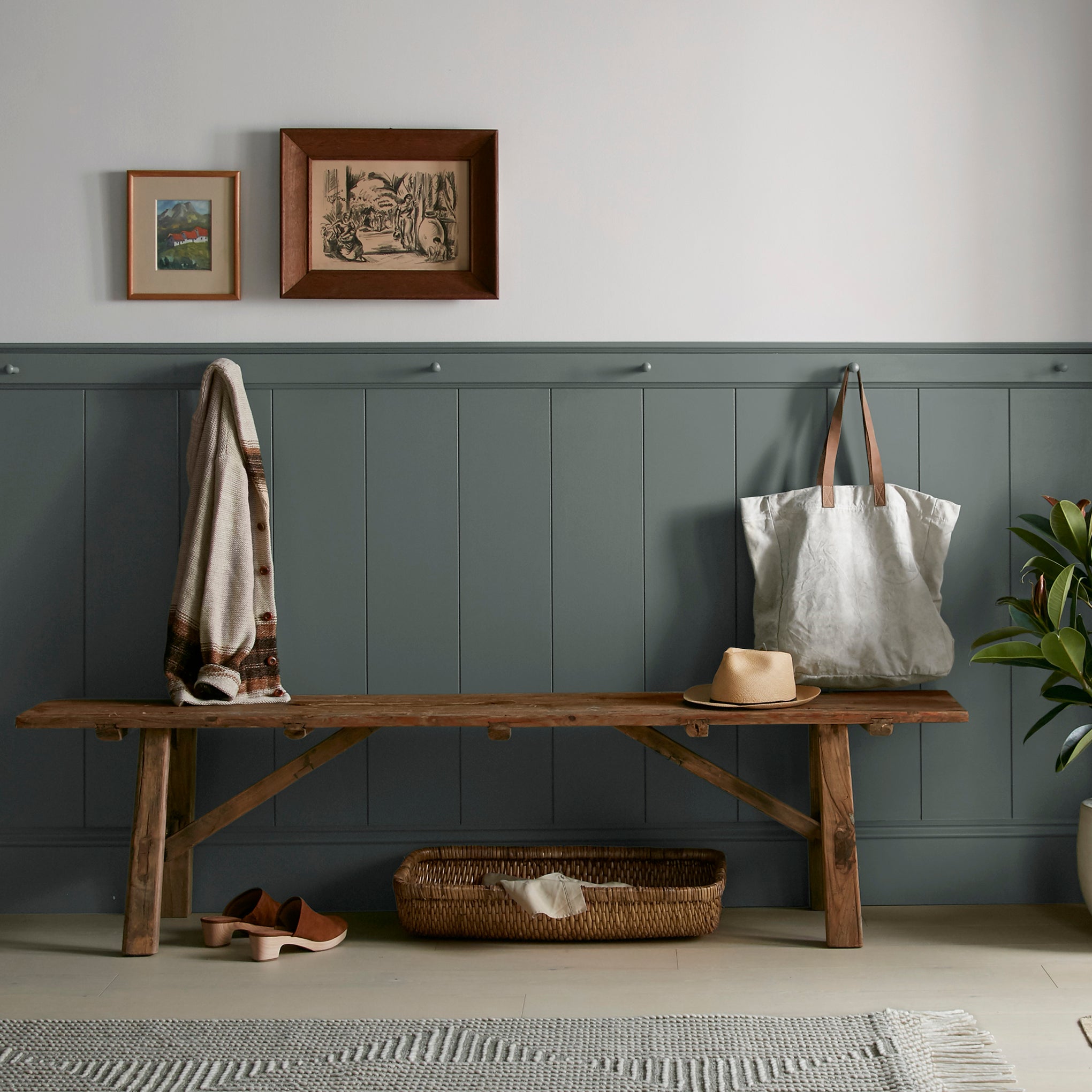 A slightly jeweled forest green hue classic interior paint named 1905 shown painted on entryway wall