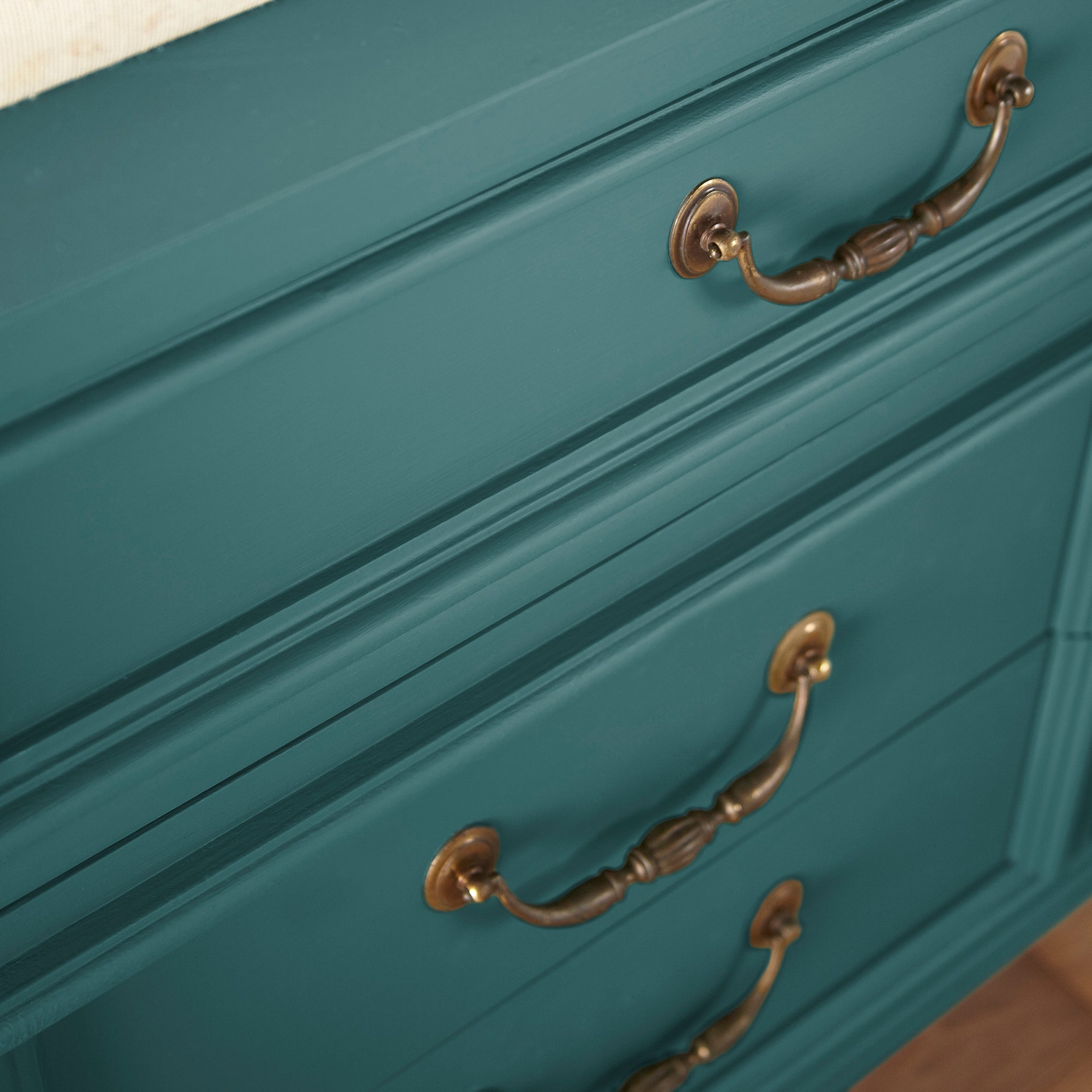 Blue and green combined to create an ashy peacock blue door and cabinet paint named water garden shown painted on cabinet