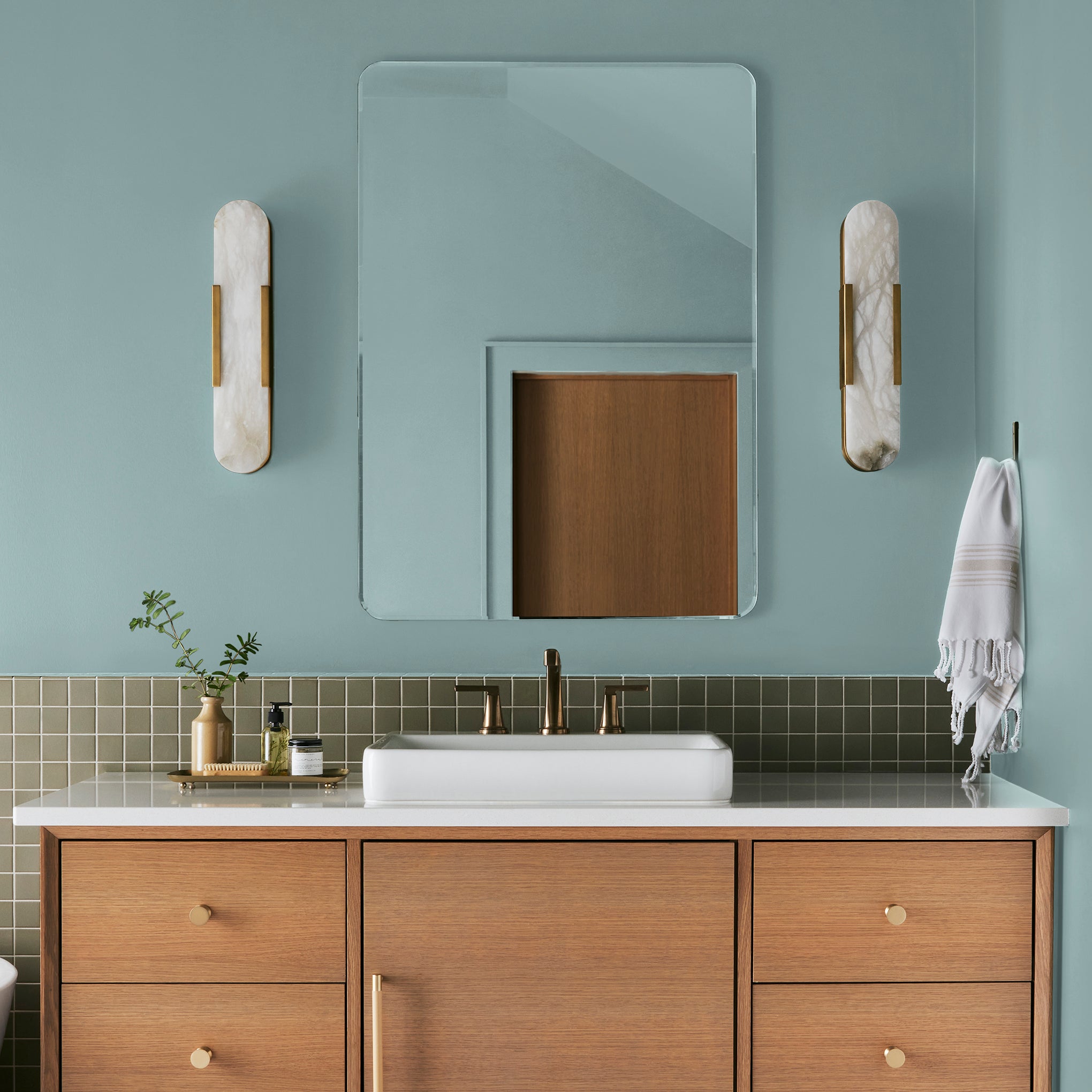 sky blue with grey undertone paint named it is well shown painted on bathroom wall