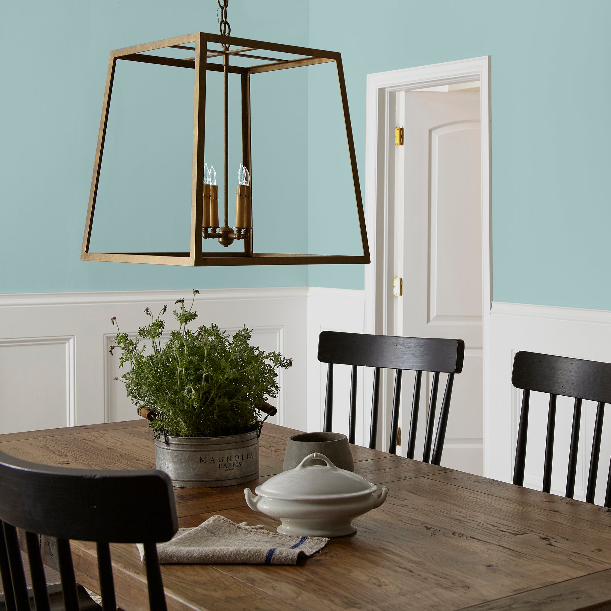 sky blue with grey undertone paint named it is well shown painted on dining room wall