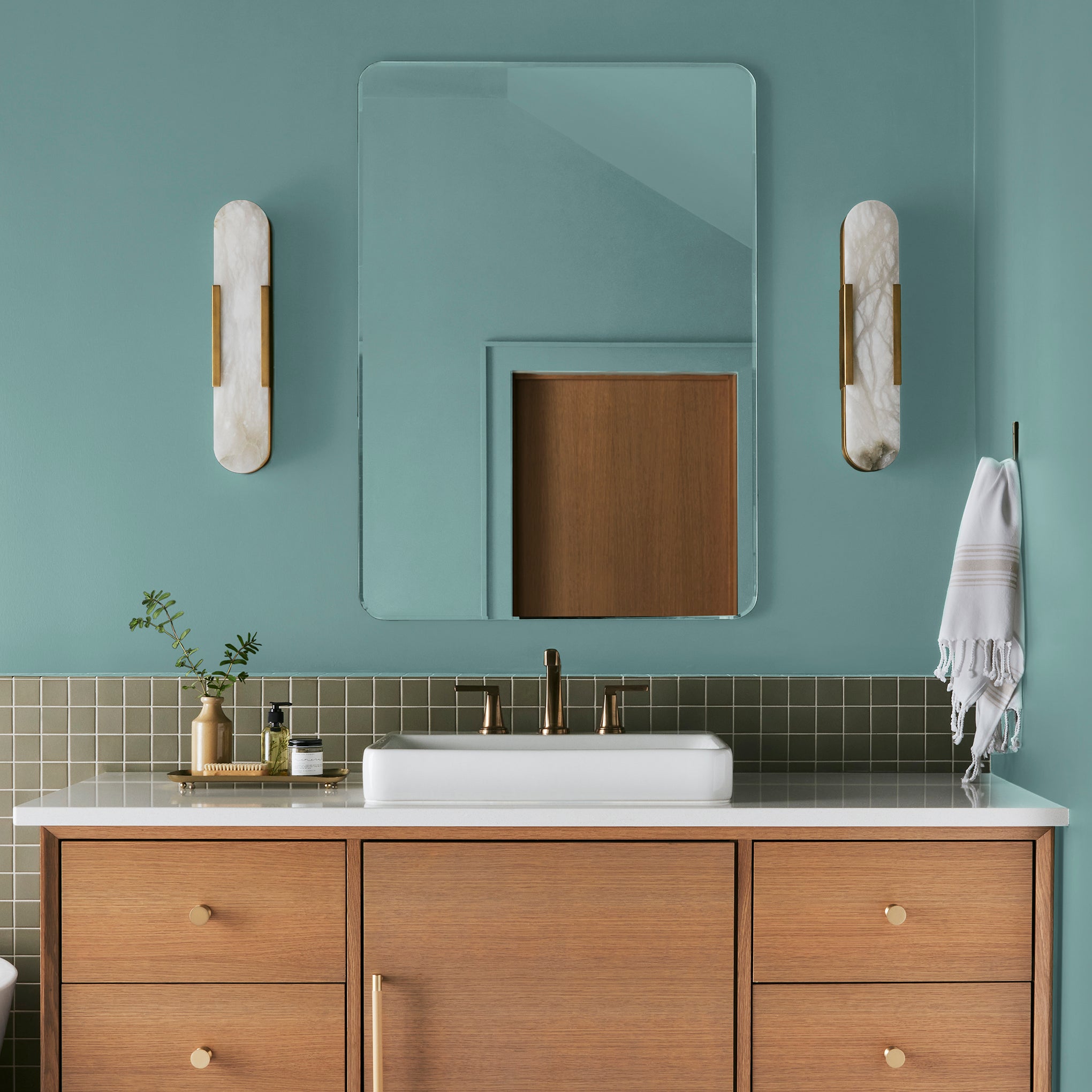 A cool aqua blue interior paint named morning calm shown painted on bathroom wall