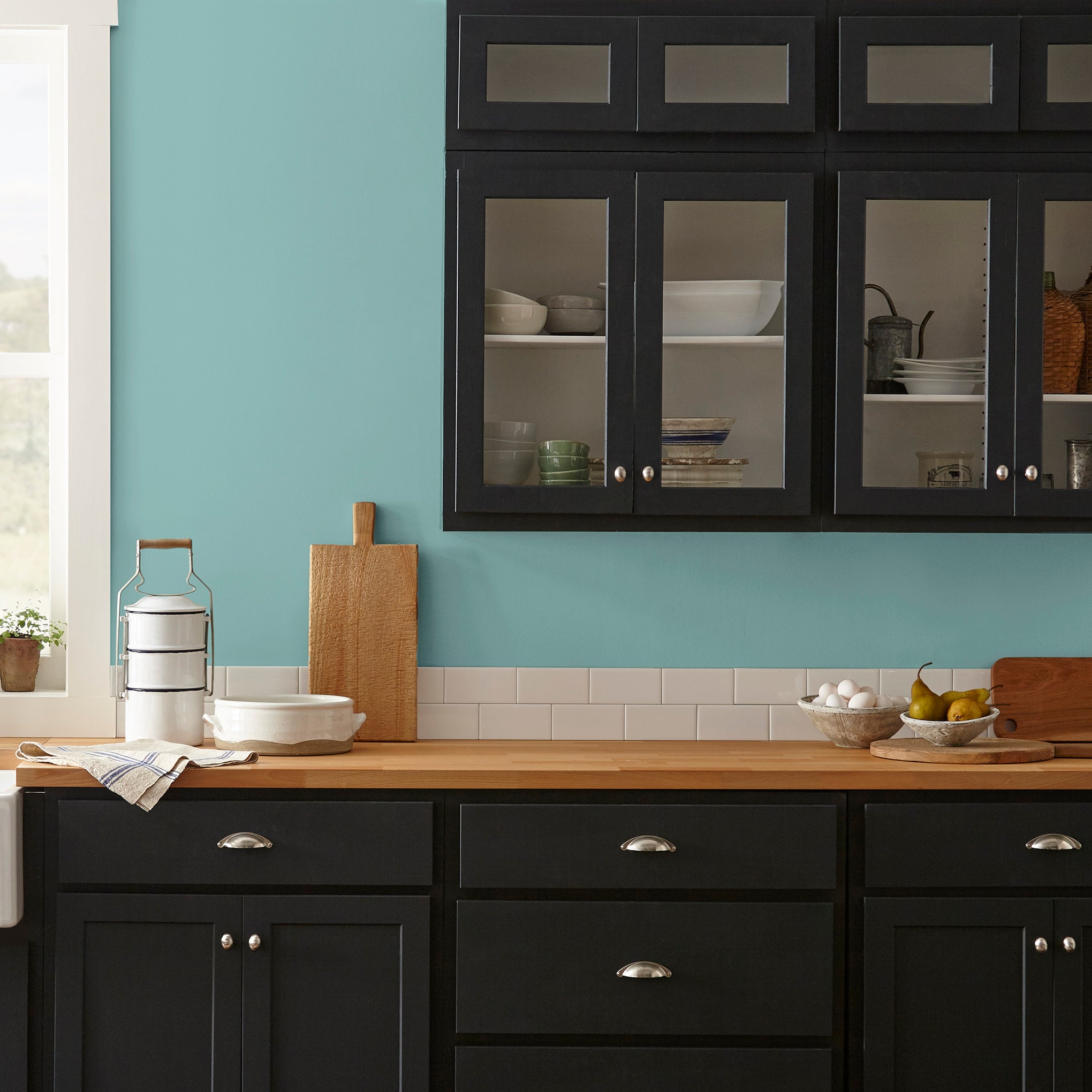 A cool aqua blue interior paint named morning calm shown painted on kitchen wall