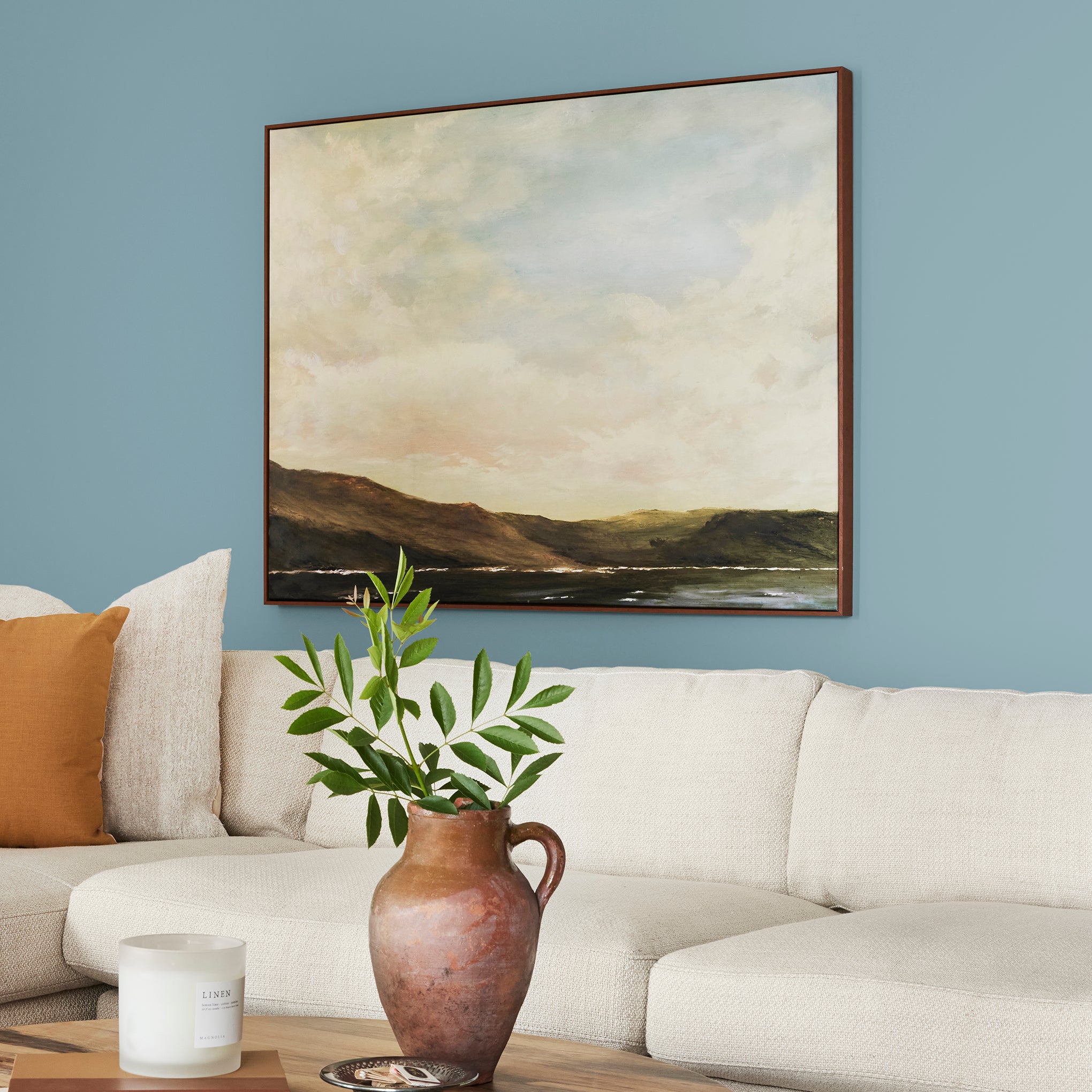 washed denim blue interior paint named winter solstice shown painted on living room wall