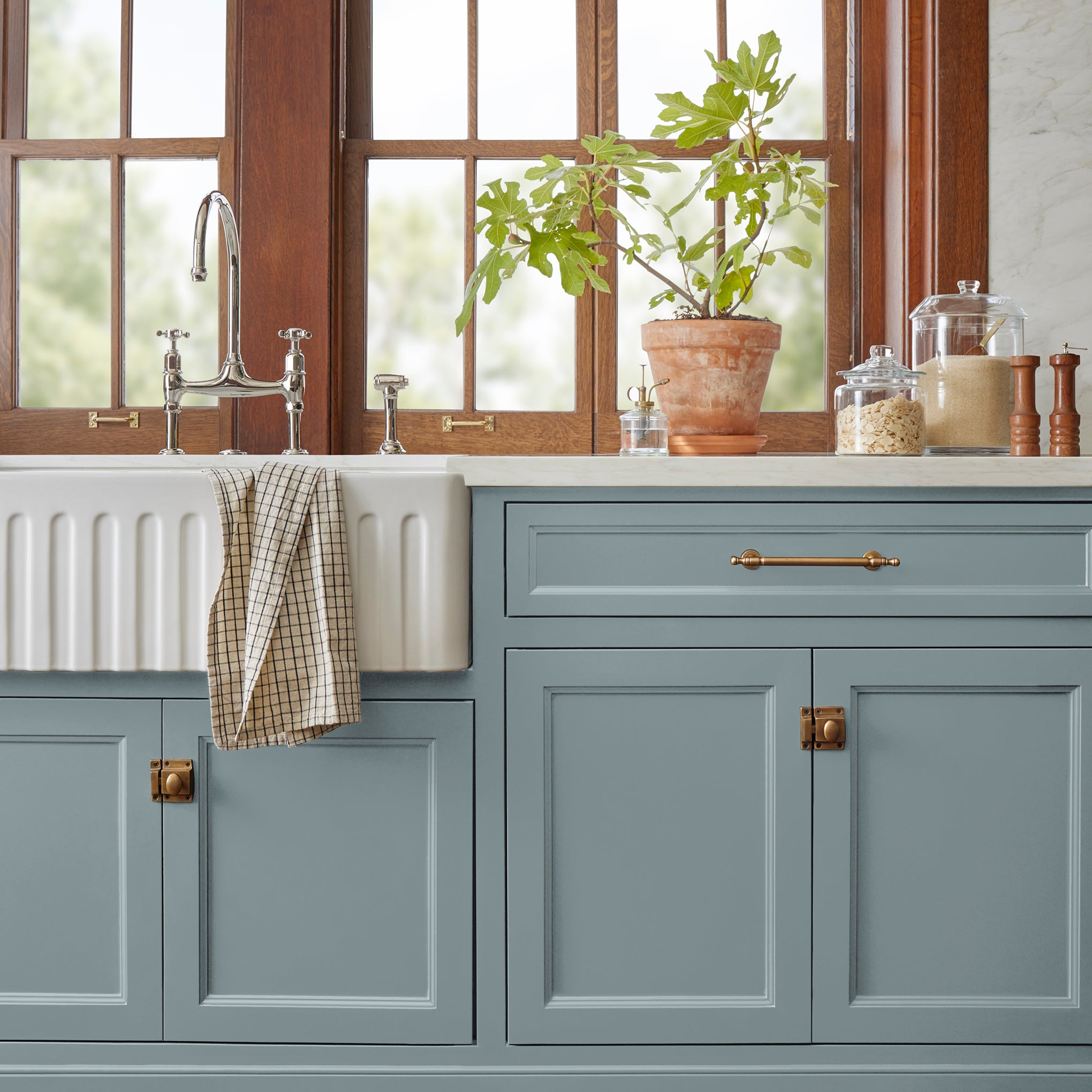 Deep dolphin gray with blue undertones door and cabinet paint named display shown painted on kitchen cabinet 