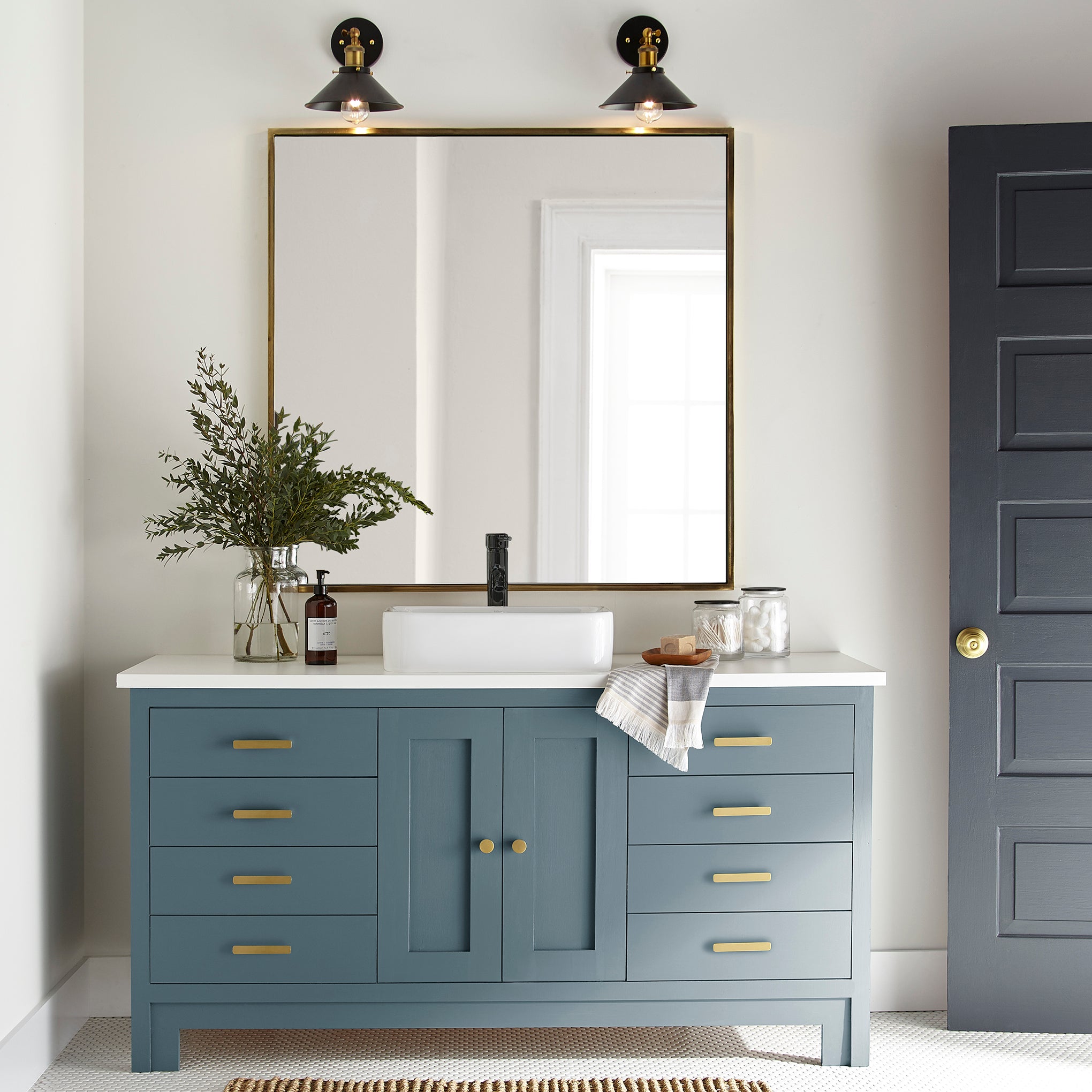 Deep steely blue door and cabinet paint named blue skies shown painted on bathroom cabinet