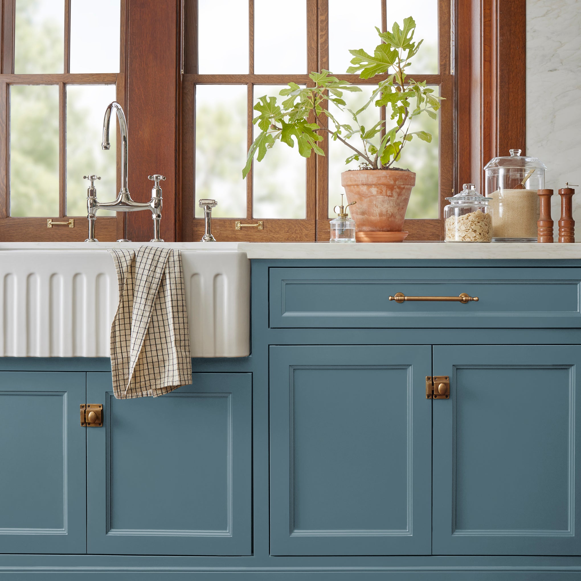 Deep steely blue door and cabinet paint named blue skies shown painted on kitchen cabinet 