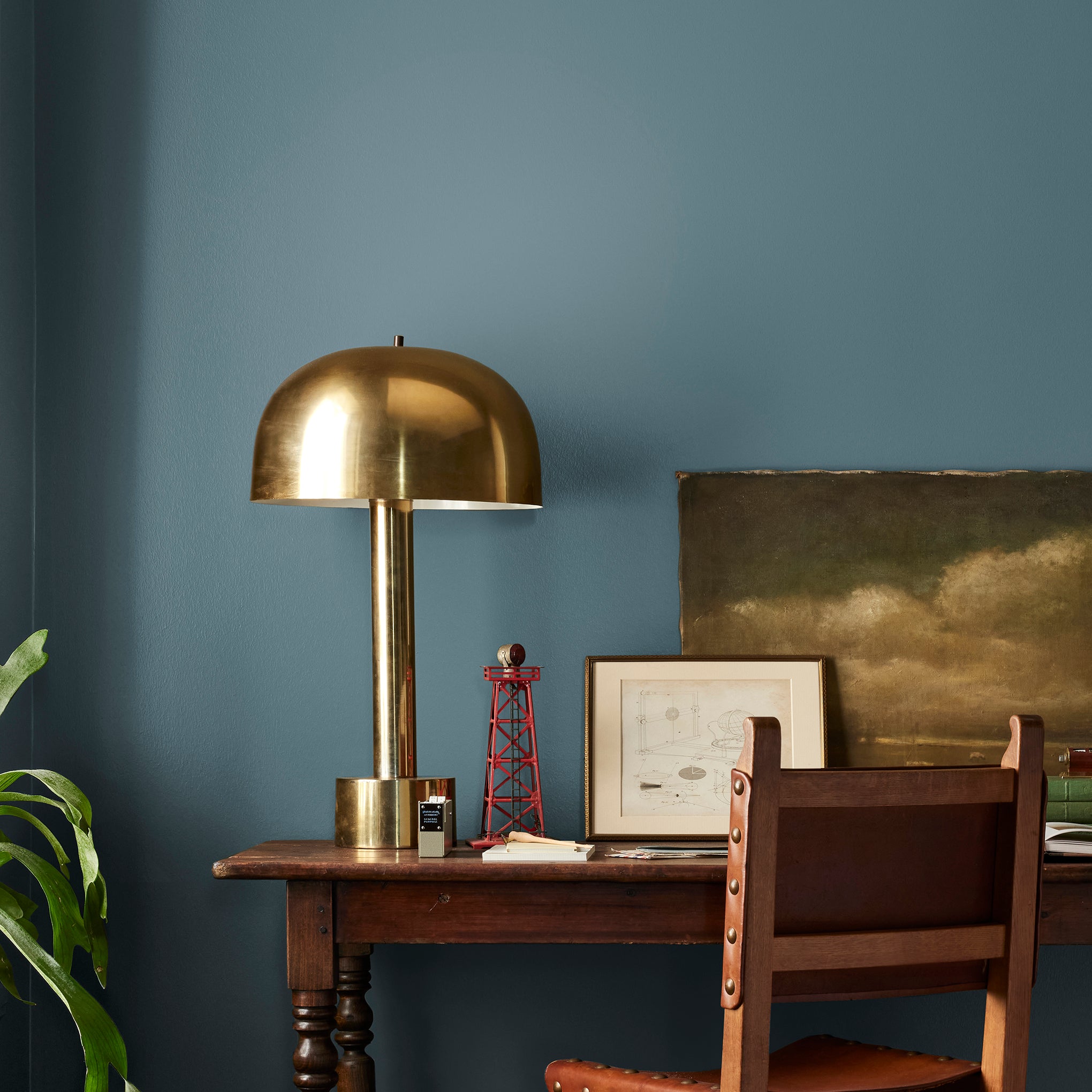 Denim blue slightly muted with gray and silver hues interior paint named bright future shown painted on bedroom wall