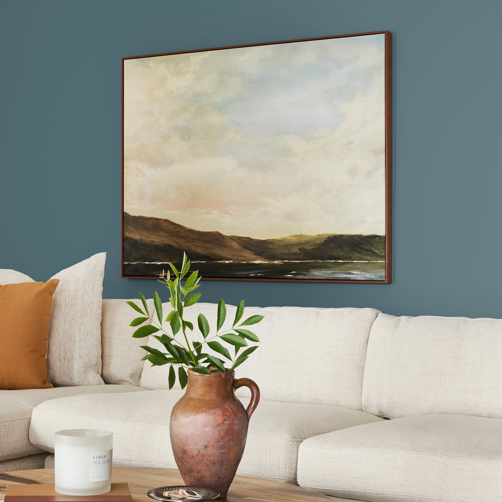 Denim blue slightly muted with gray and silver hues interior paint named bright future shown painted on living room wall