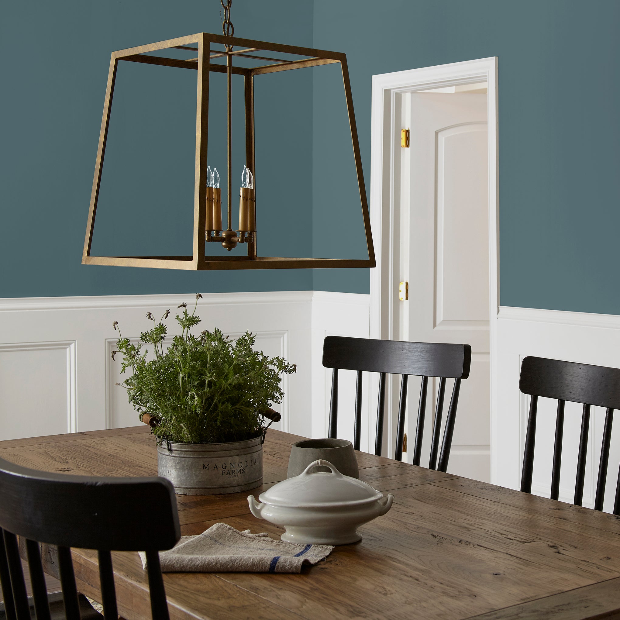 Deep sea blue interior paint named together shown painted on dining room wall