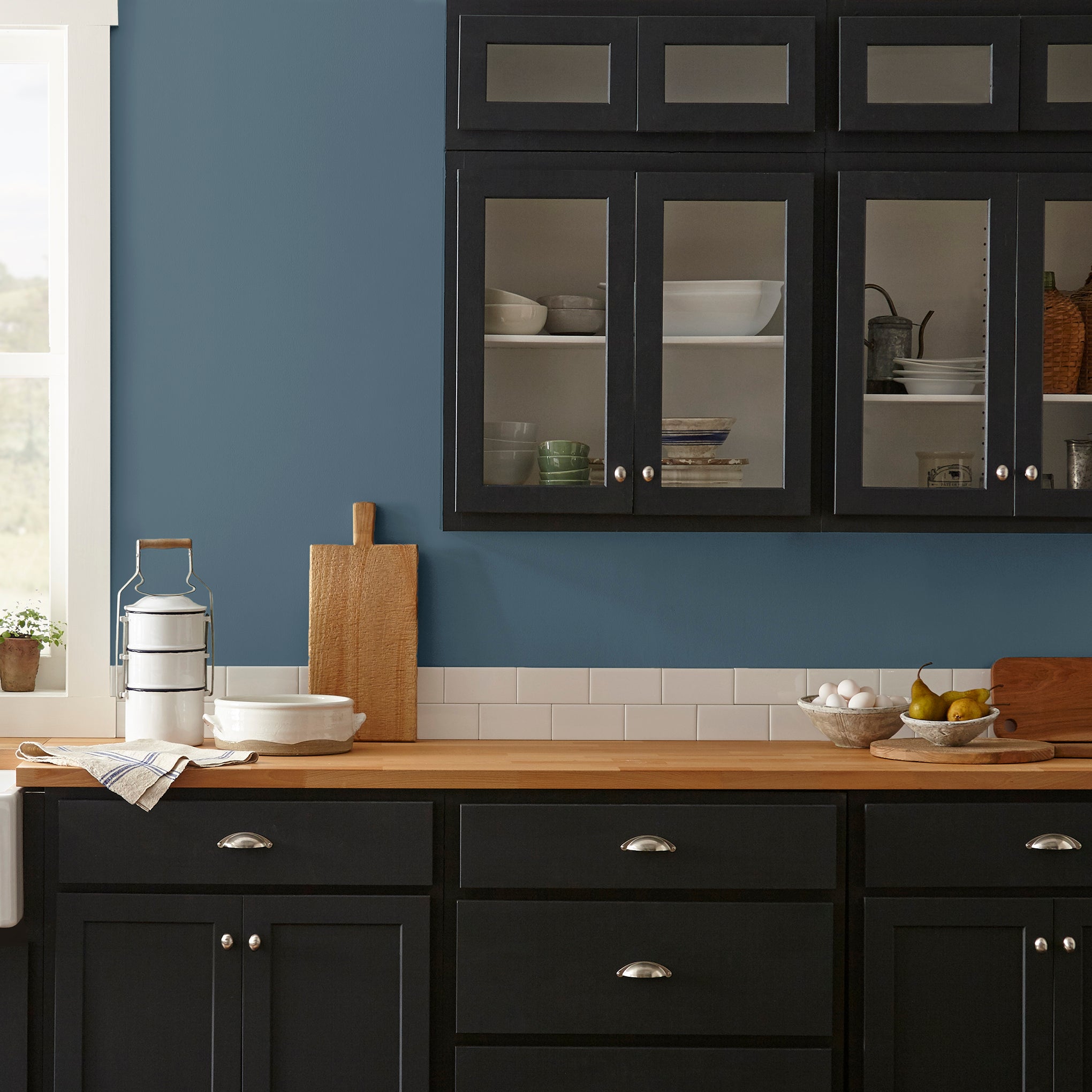 dark royal blue paint named silos district shown painted on kitchen wall