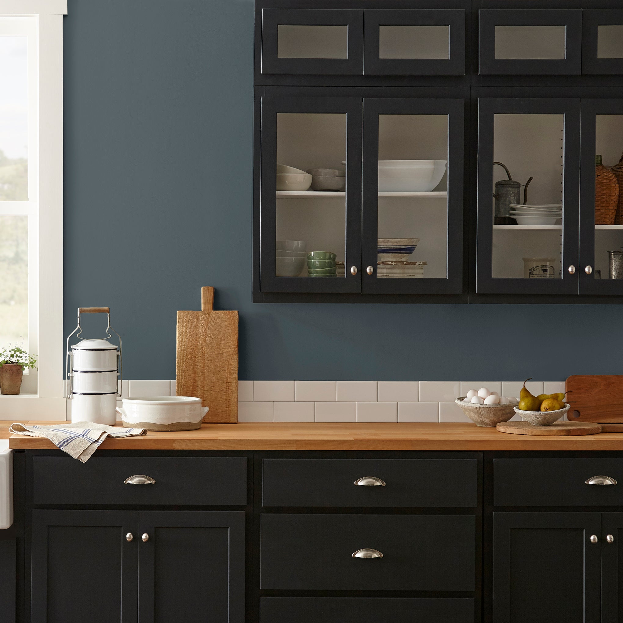 Almost black with dark blue undertones interior paint named arches shown painted on kitchen wall