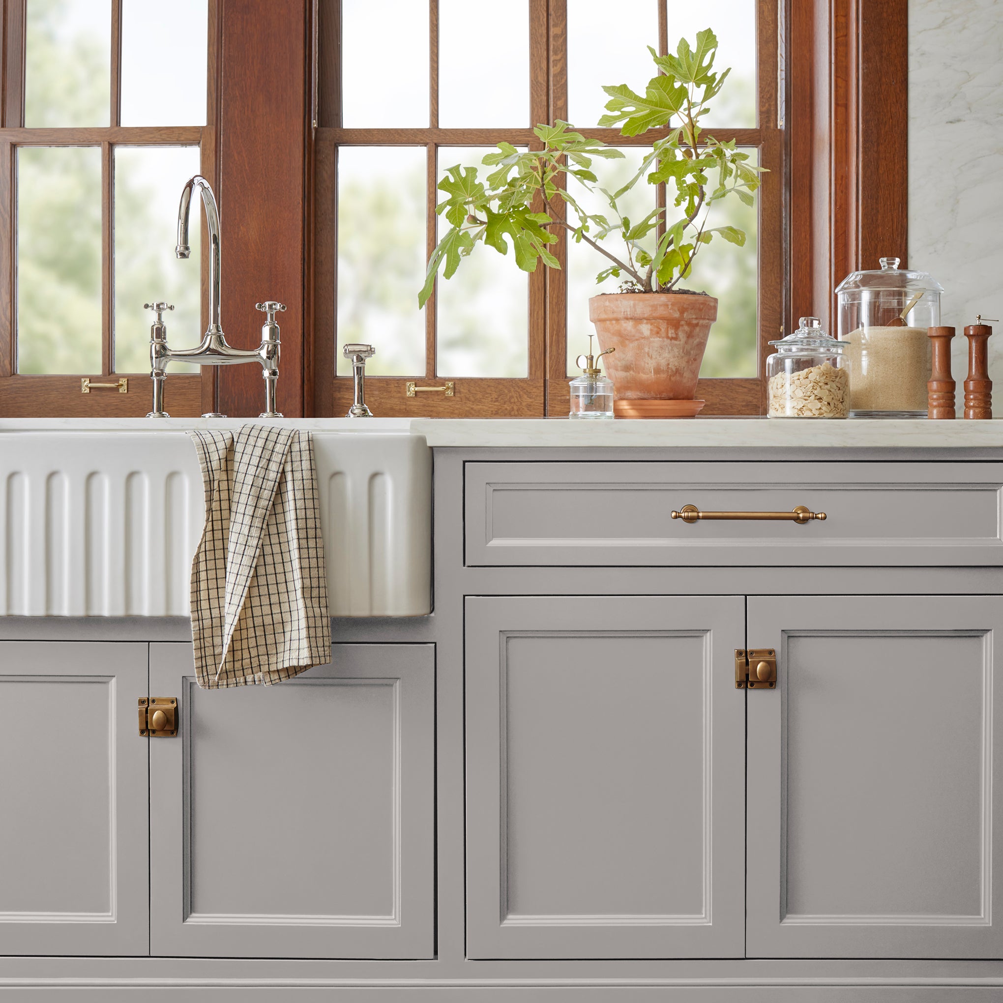 Lavender blush blended with ivory gray door and cabinet paint named vintage collection shown painted on kitchen cabinet 