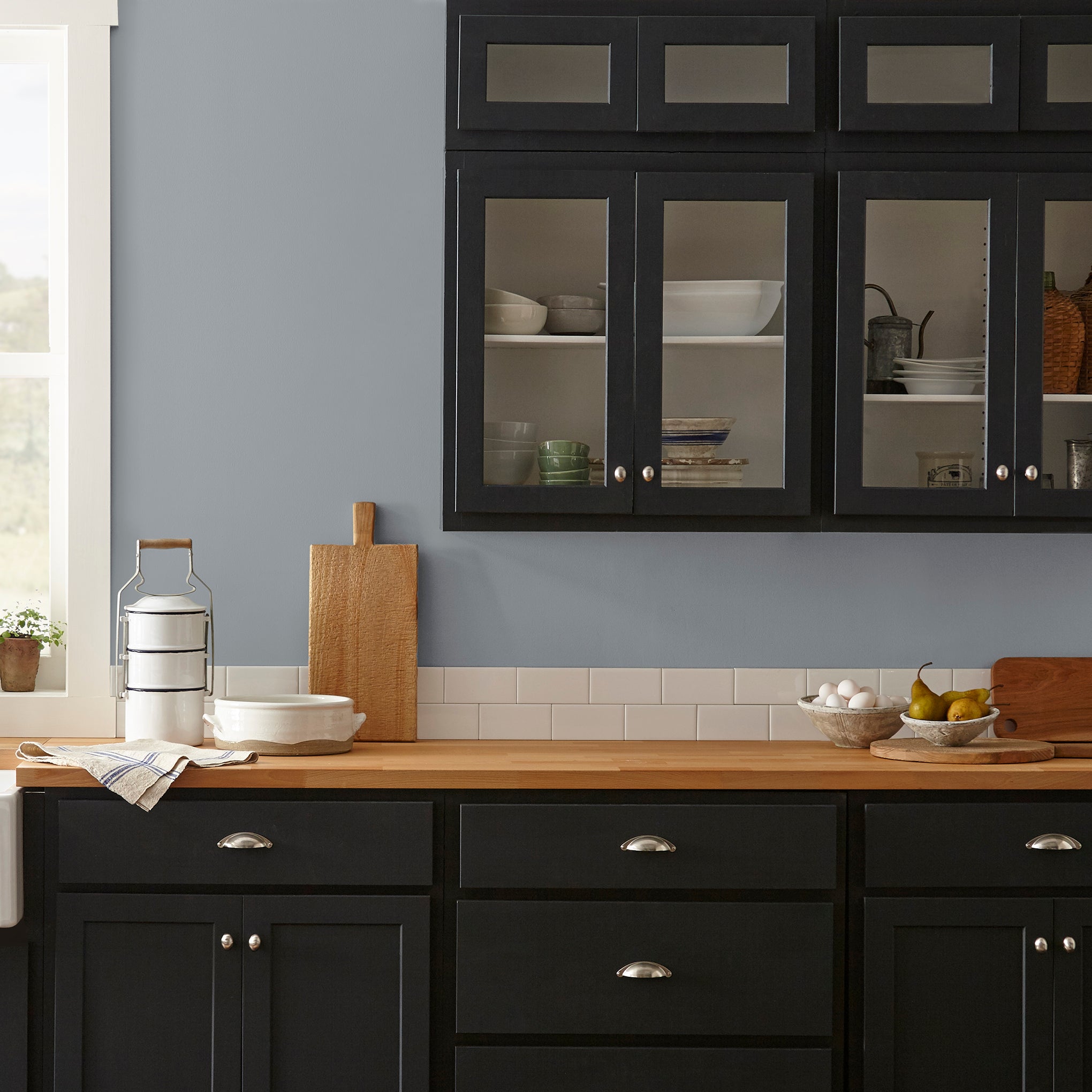 dark cool grey paint named times past shown painted on kitchen wall