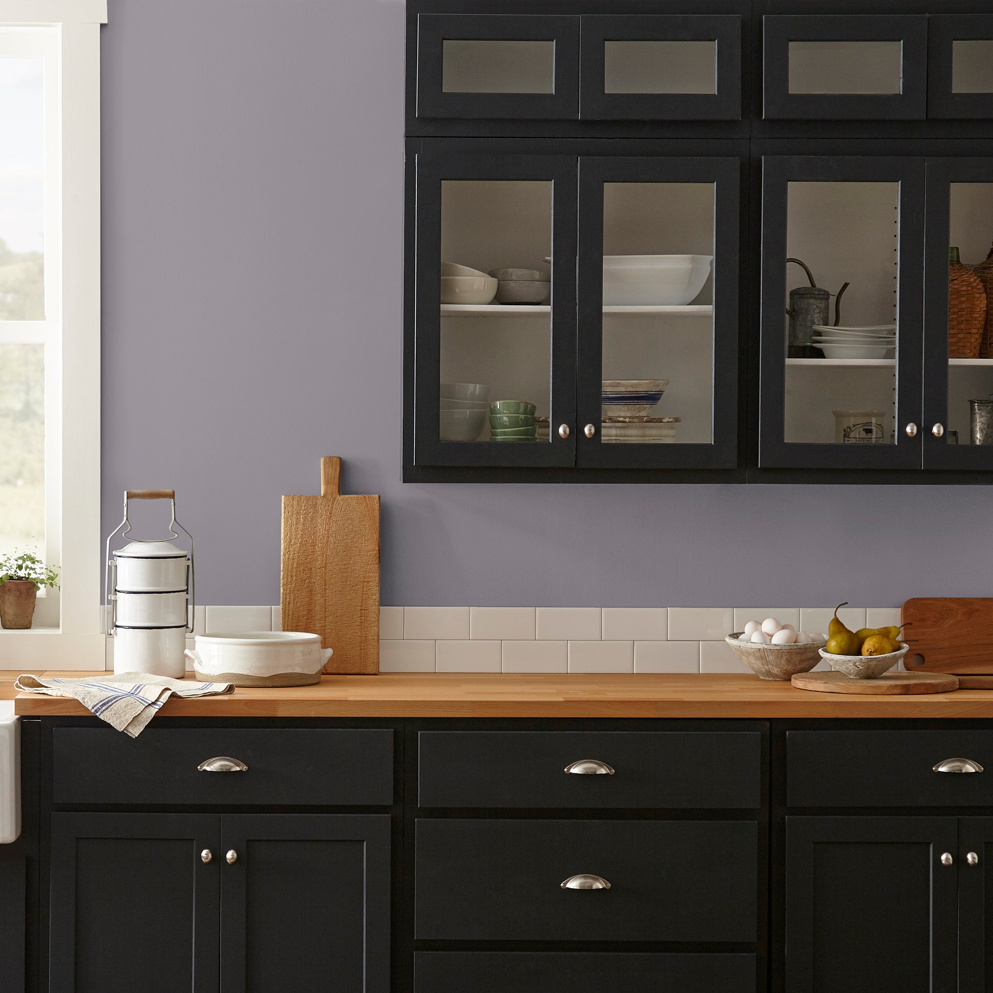 deep pastel purple paint named pashmina plum shown painted on kitchen wall