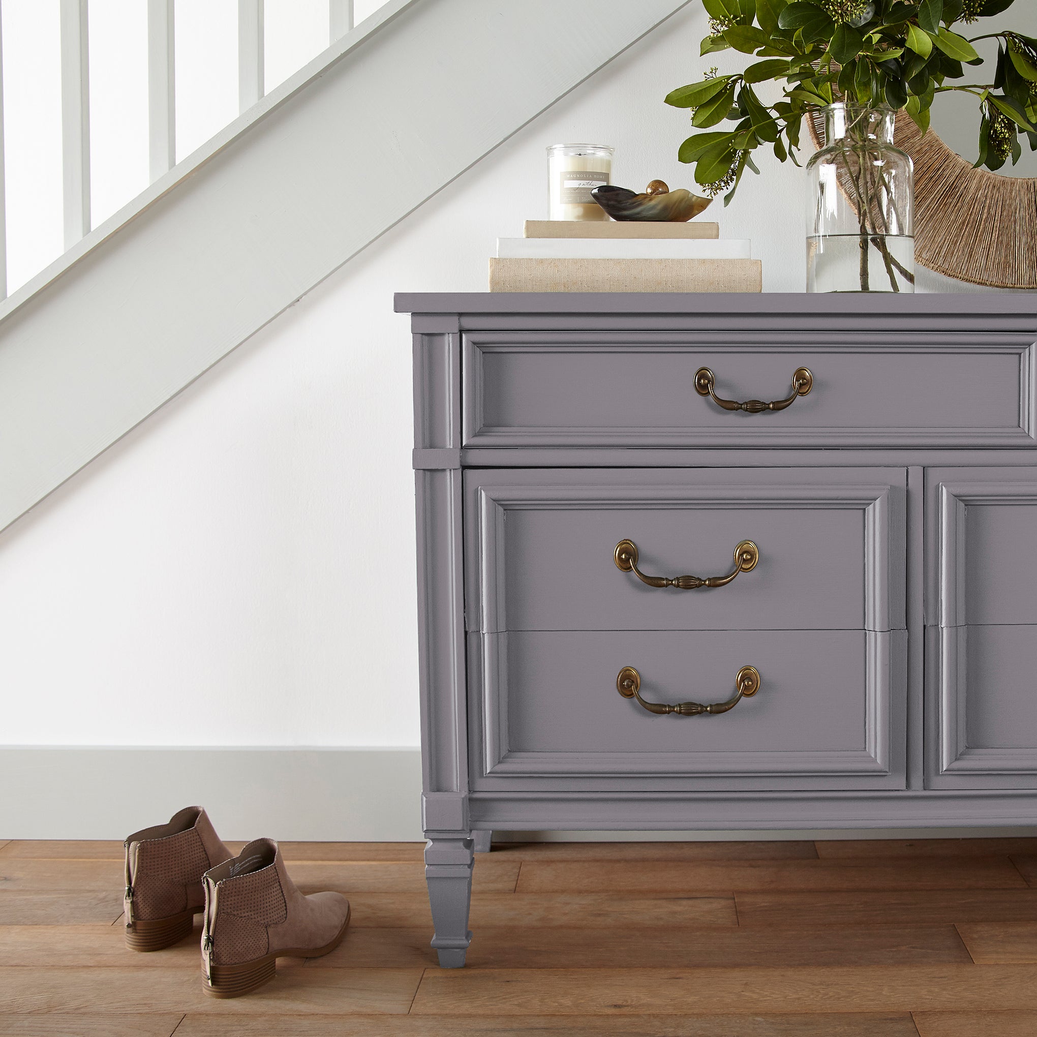Deep pastel purple door and cabinet paint named pashmina plum shown painted on entryway cabinet