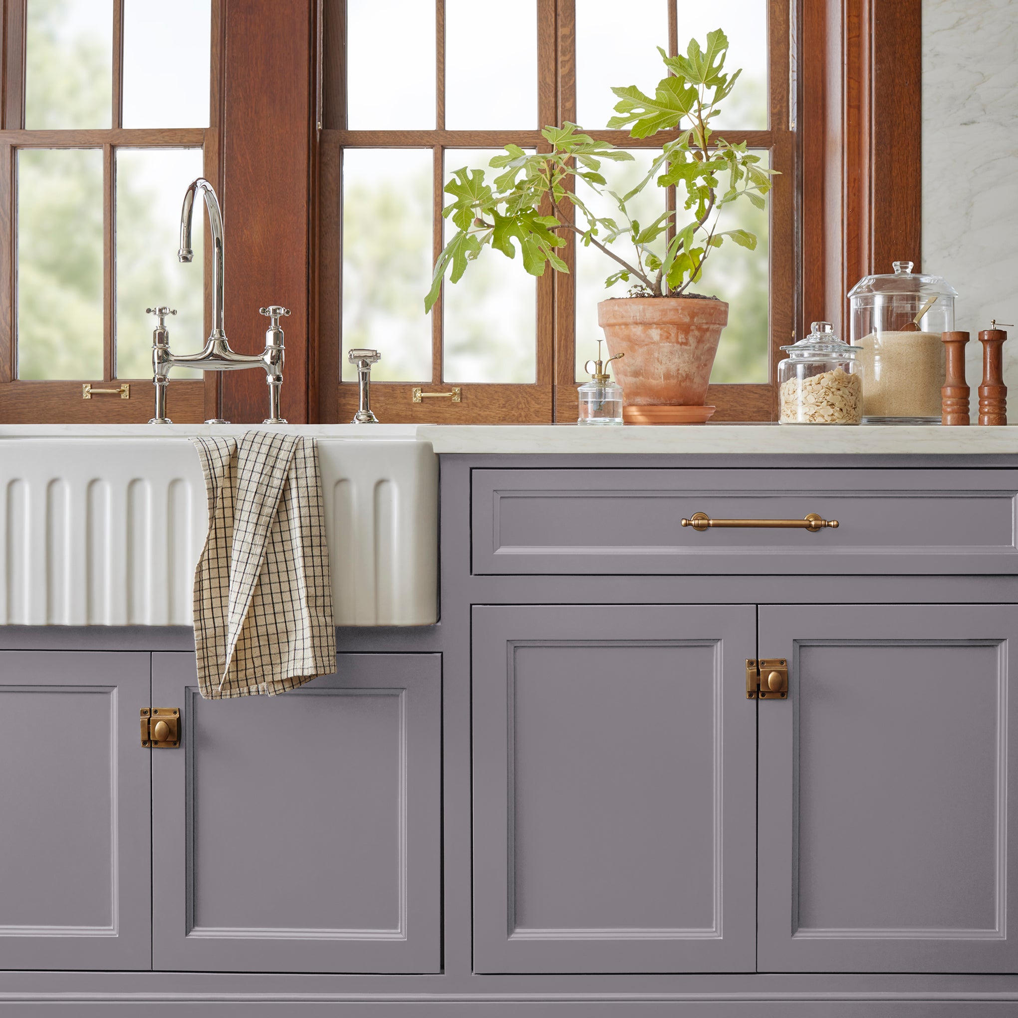 Deep pastel purple door and cabinet paint named pashmina plum shown painted on kitchen cabinet 