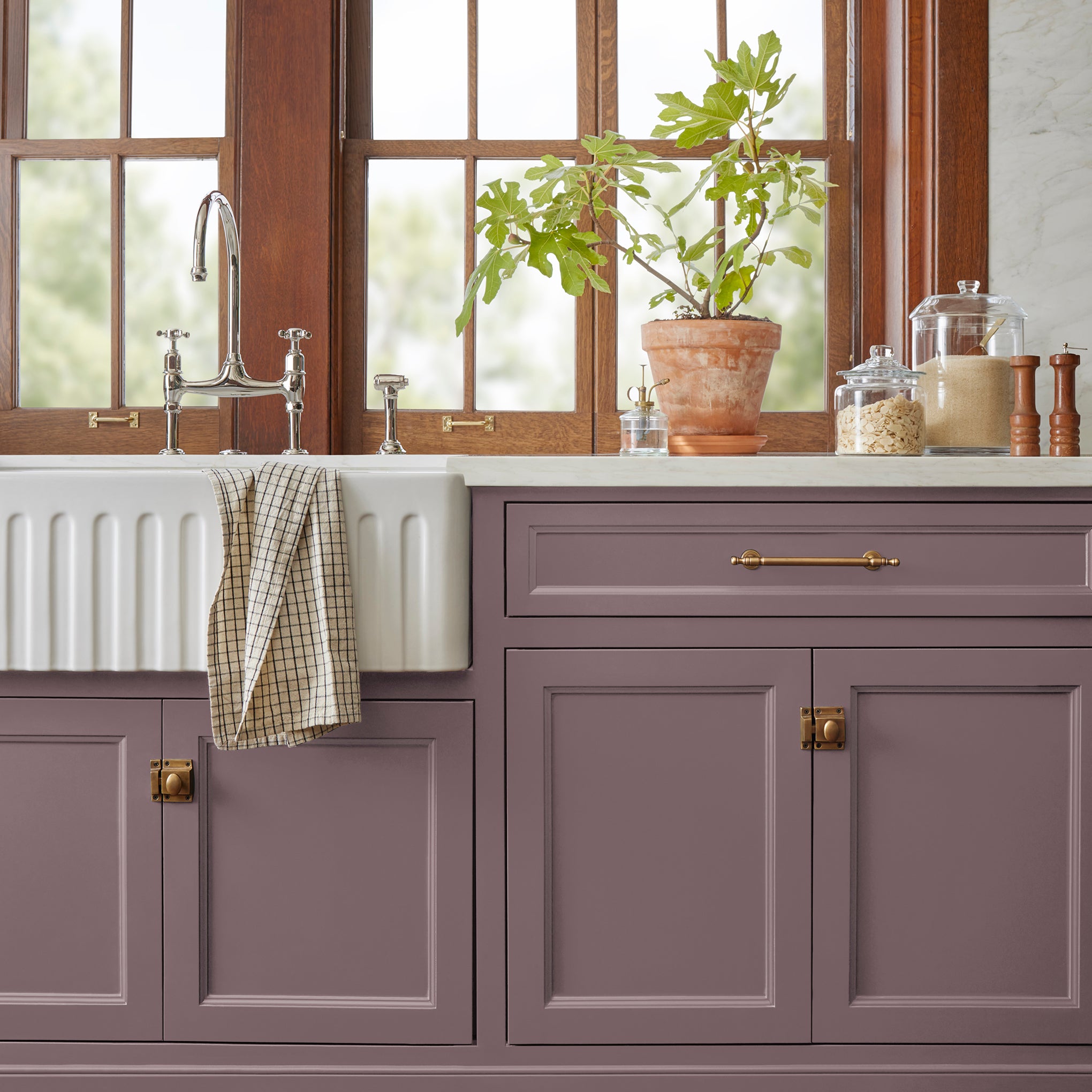 Deep and dusty berry door and cabinet paint named webster avenue shown painted on kitchen cabinet  