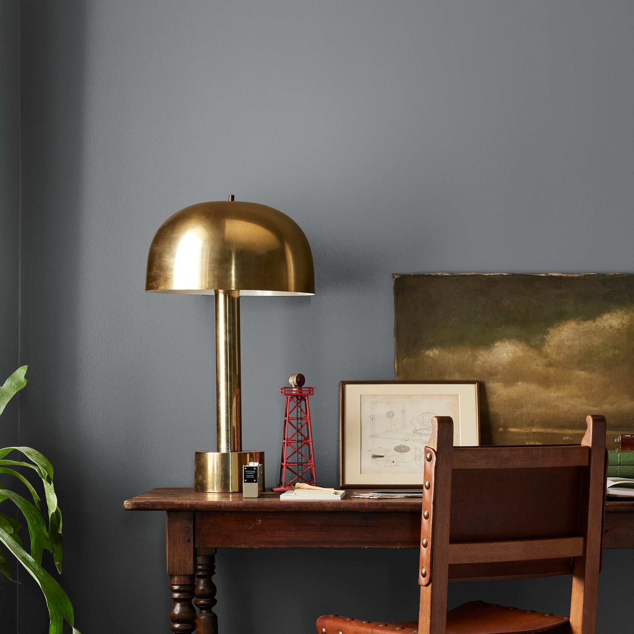 Deep slate gray paint with blue undertones named texas storm shown painted on bedroom wall
