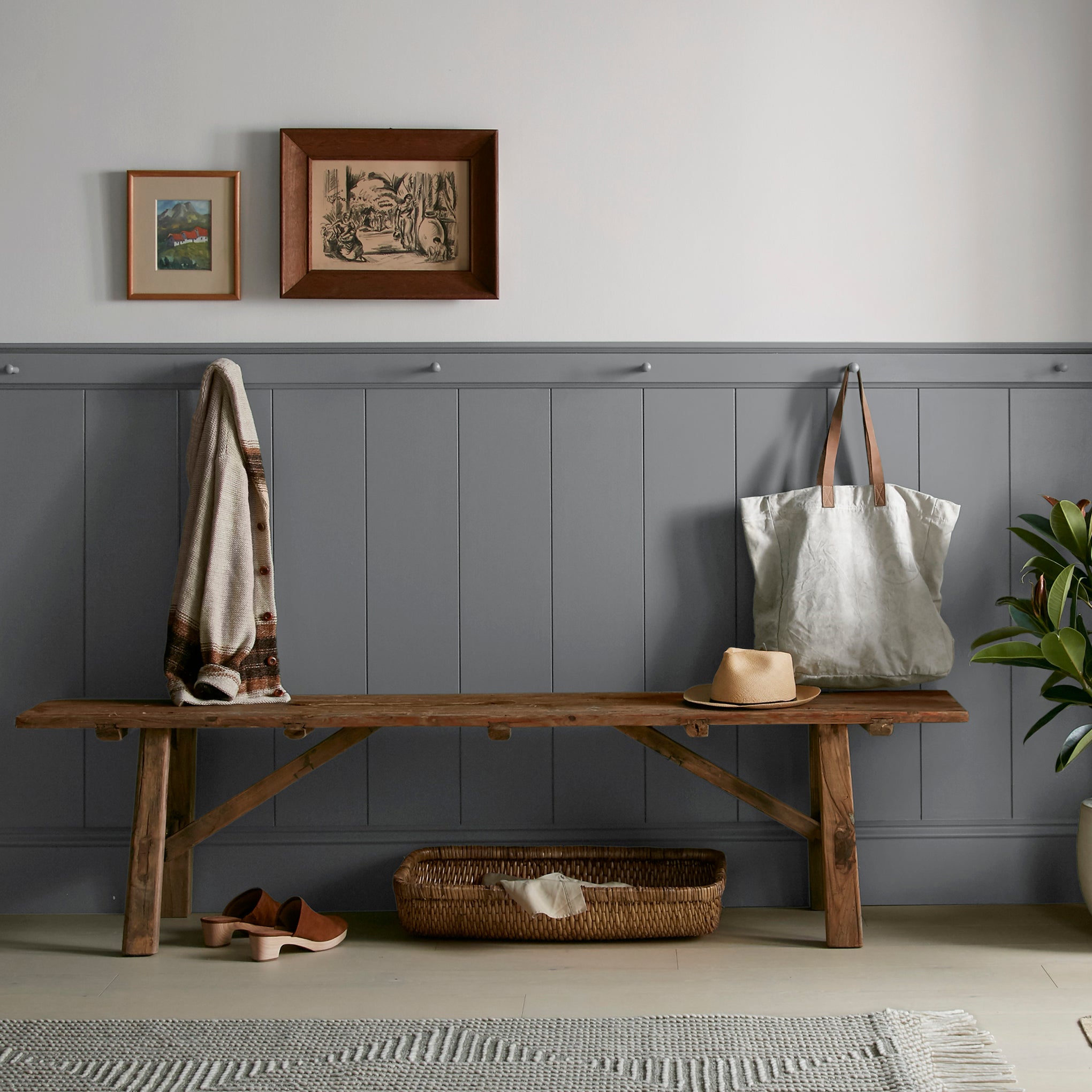 Deep slate gray paint with blue undertones named texas storm shown painted on entryway wall