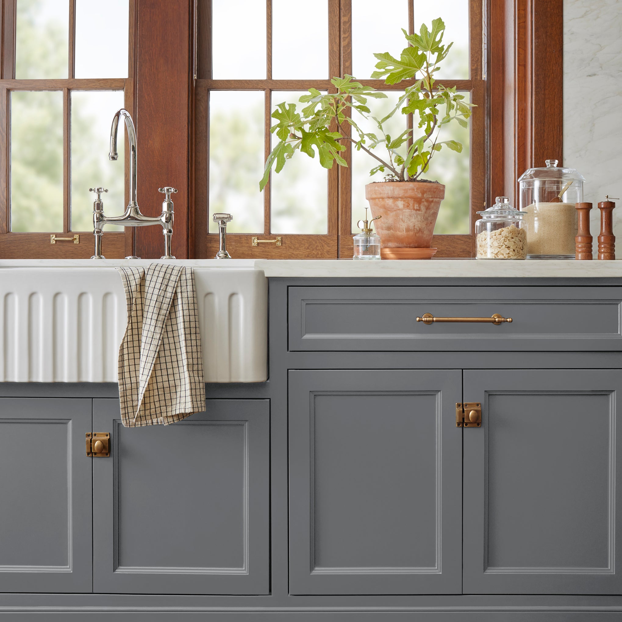 Deep slate gray with blue undertones door and cabinet paint named texas storm shown painted on kitchen cabinet