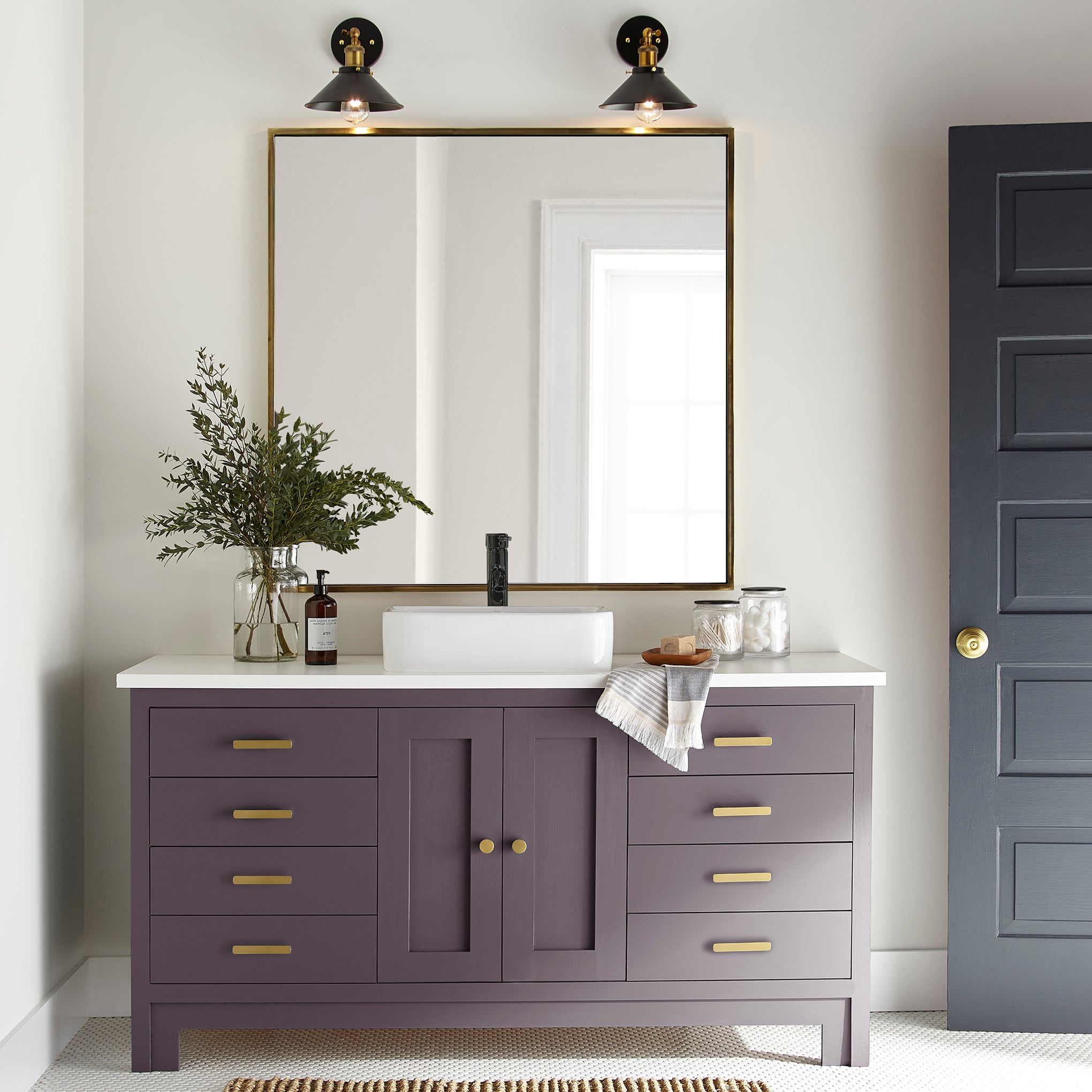 Deep eggplant purple door and cabinet paint named plum suede shown painted on bathroom cabinet