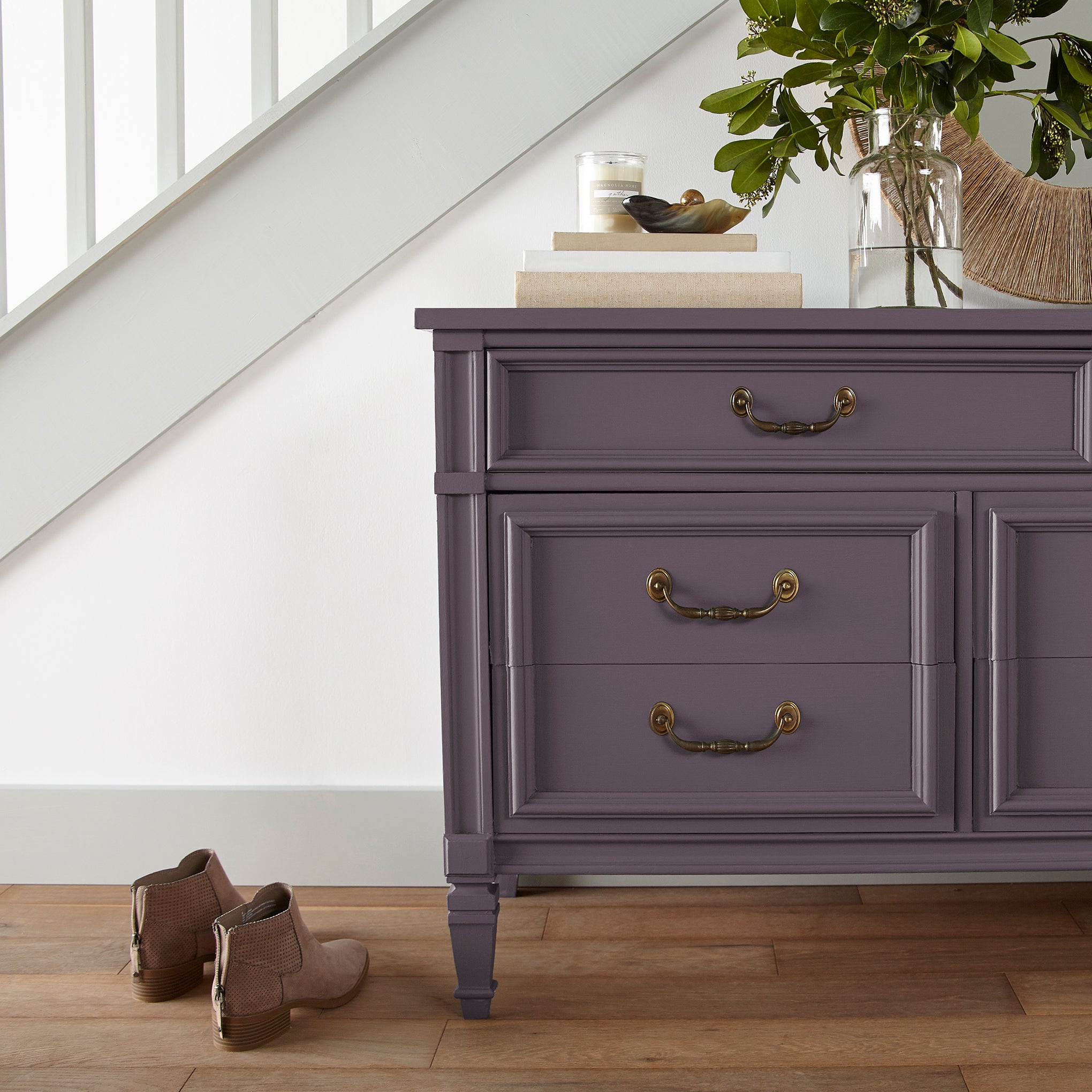 Deep eggplant purple door and cabinet paint named plum suede shown painted on entryway cabinet