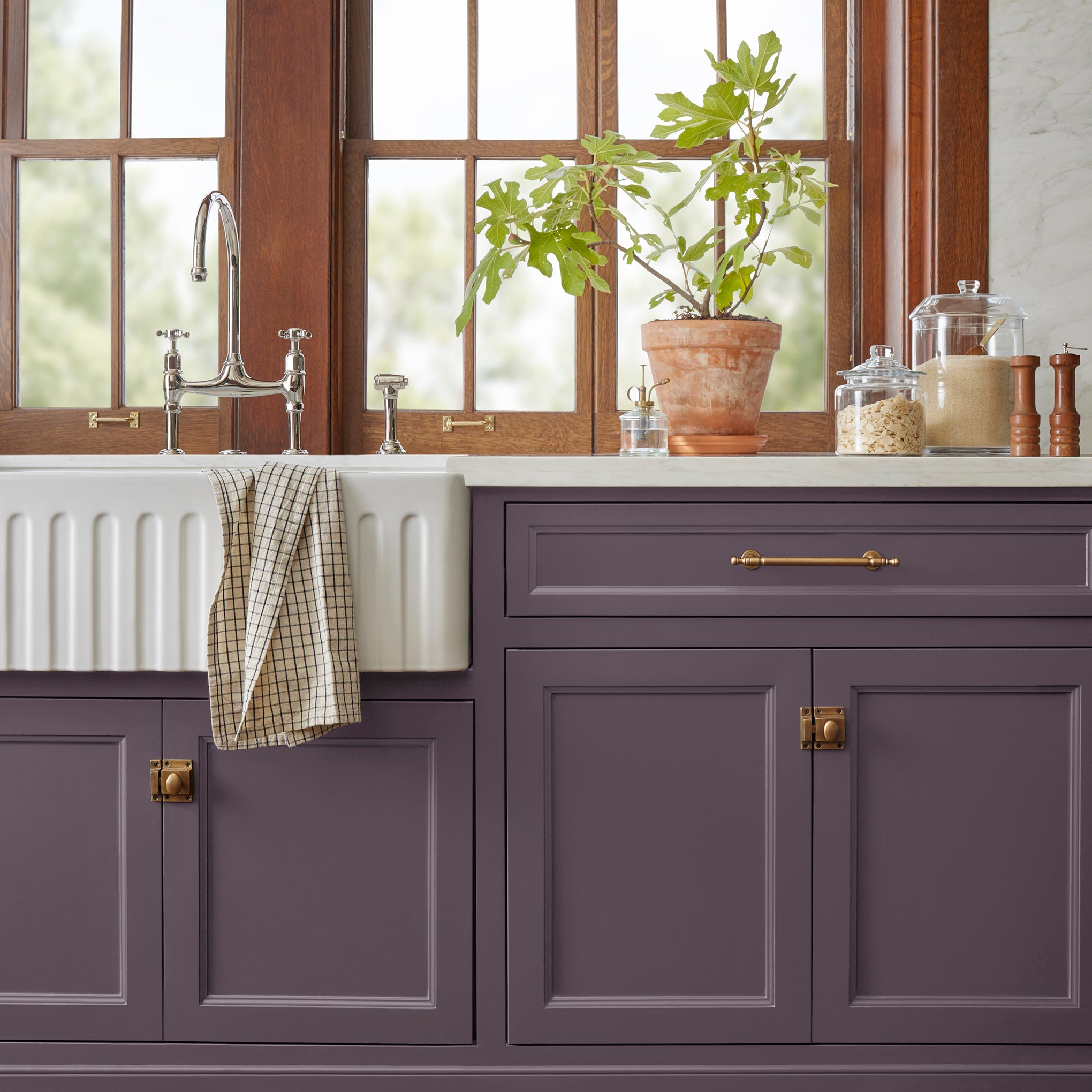 Deep eggplant purple door and cabinet paint named plum suede shown painted on kitchen cabinet