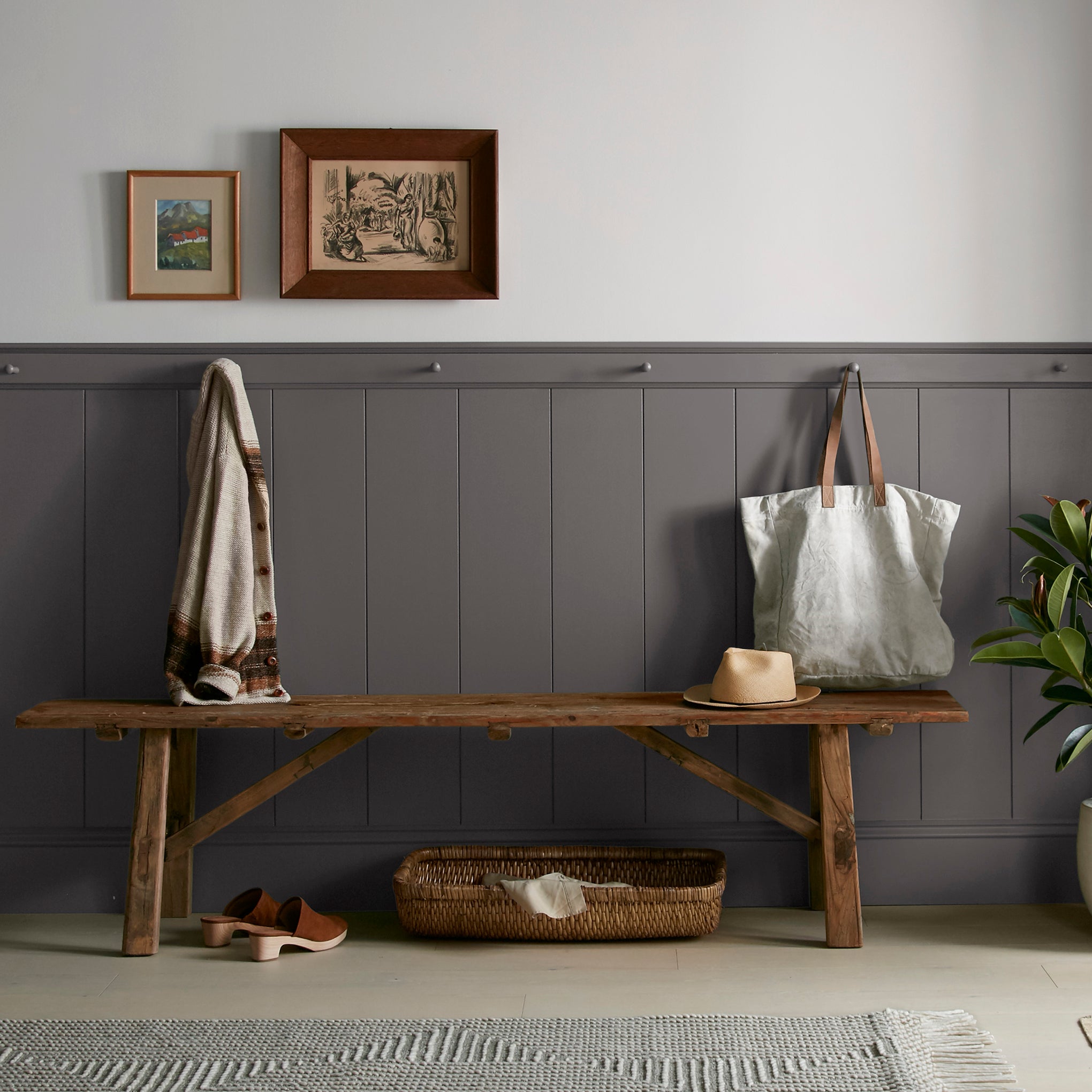 Deep brown with wine and beet red hues interior paint named pecan grove shown painted on entryway wall