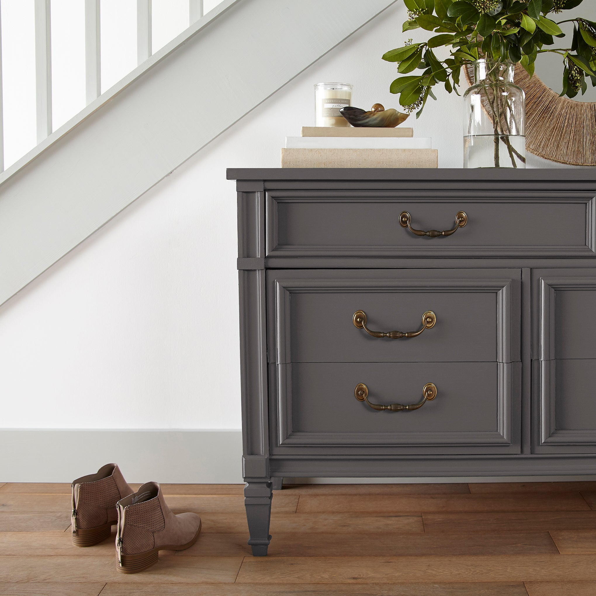 Deep brown with wine and beet red hues door and cabinet paint named pecan grove shown painted on entryway cabinet