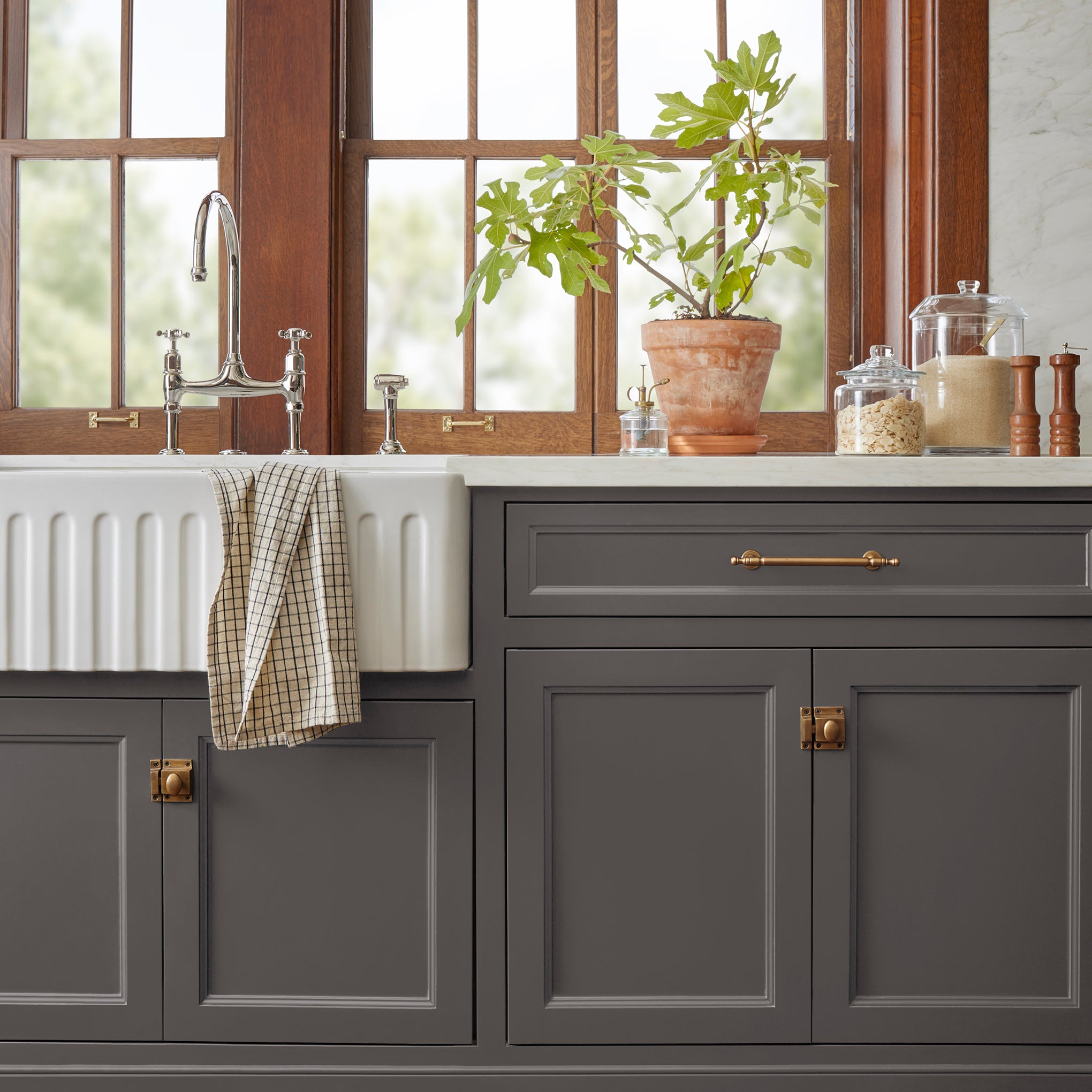 Deep brown with wine and beet red hues door and cabinet paint named pecan grove shown painted on kitchen cabinet
