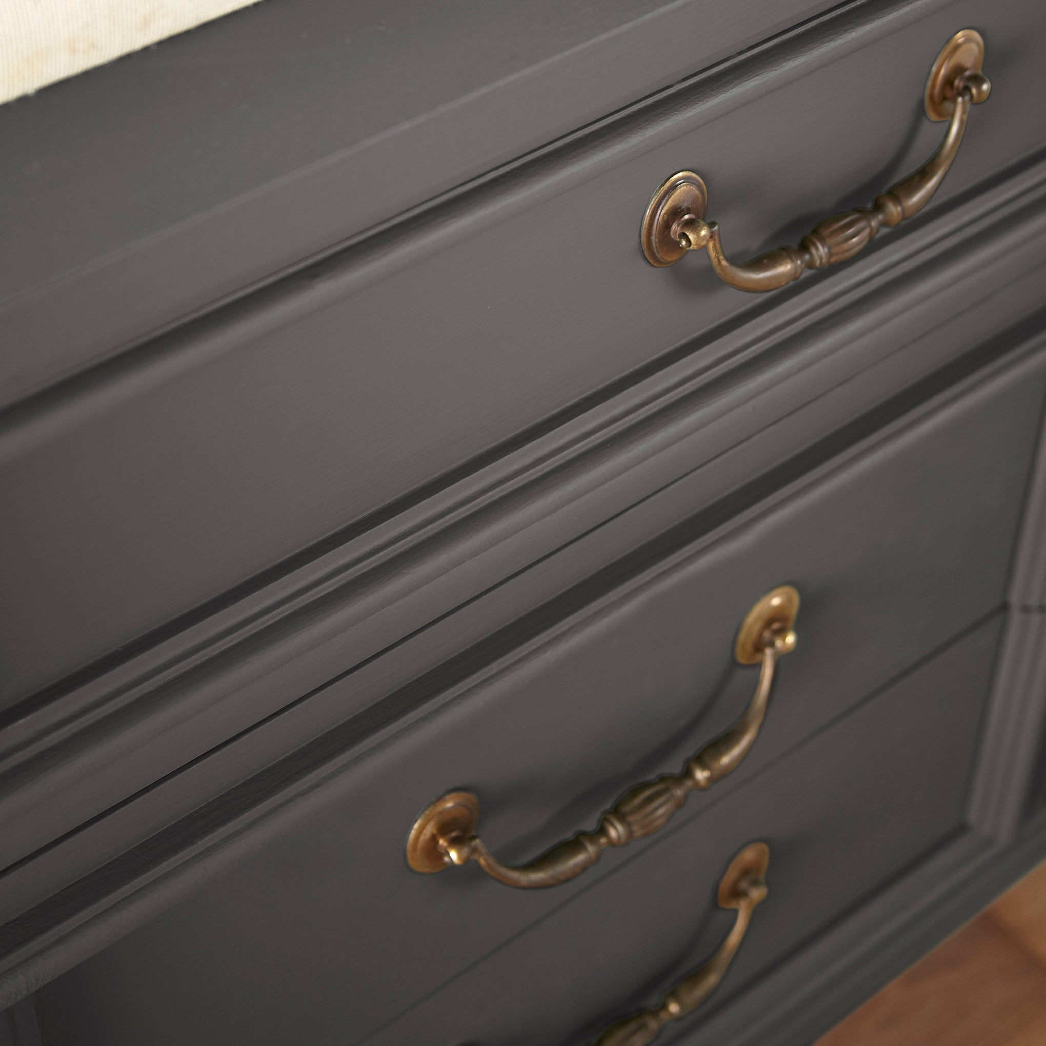 Dark chocolate brown with notes of red wine door and cabinet paint named moments shown painted on cabinet