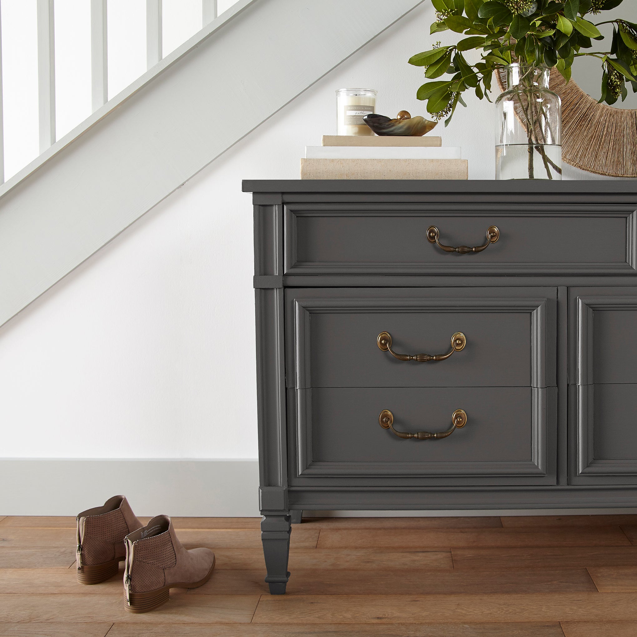 Dark chocolate brown with notes of red wine door and cabinet paint named moments shown painted on entryway cabinet