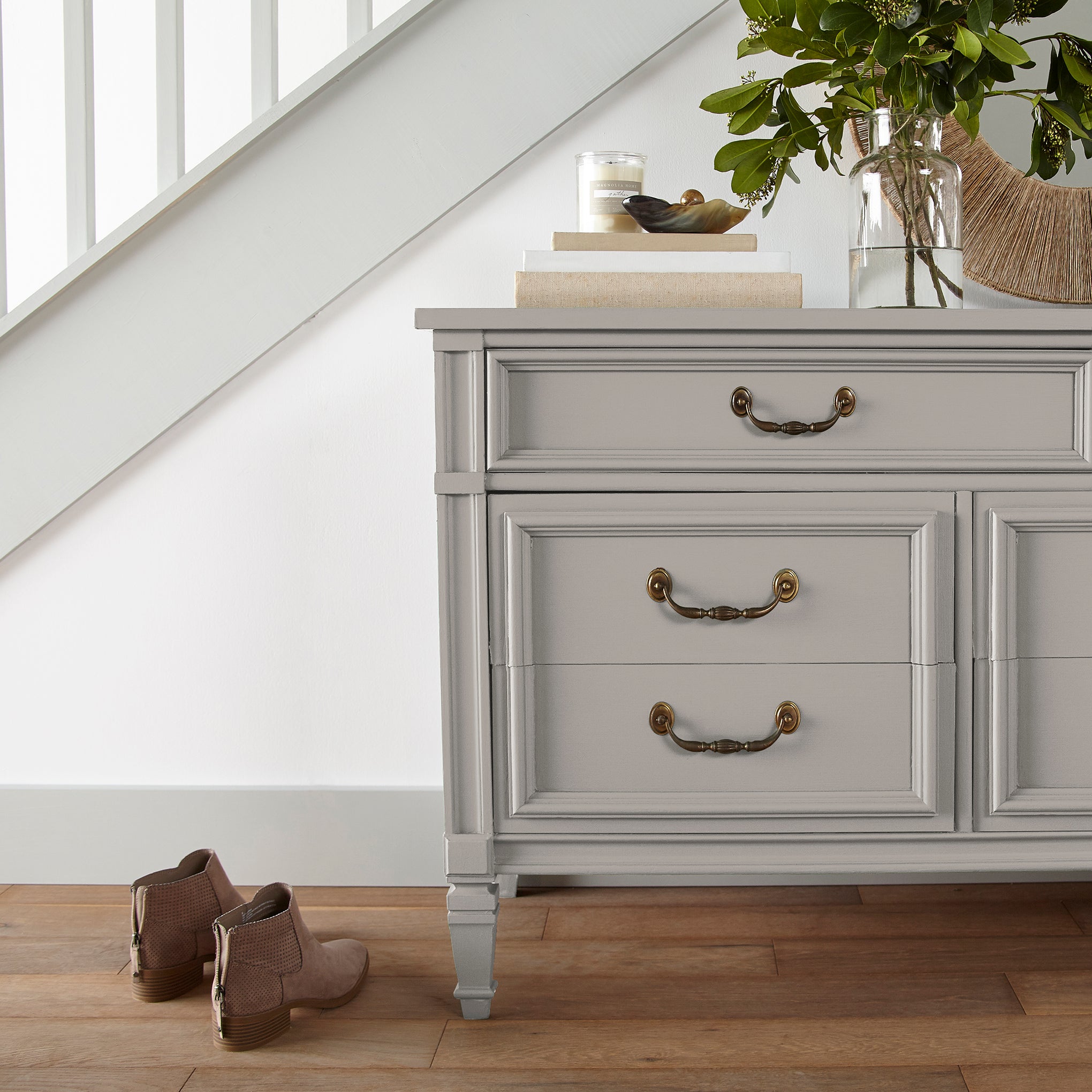 Soft tan with notes of gray door and cabinet paint named anatolian shown painted on entryway cabinet
