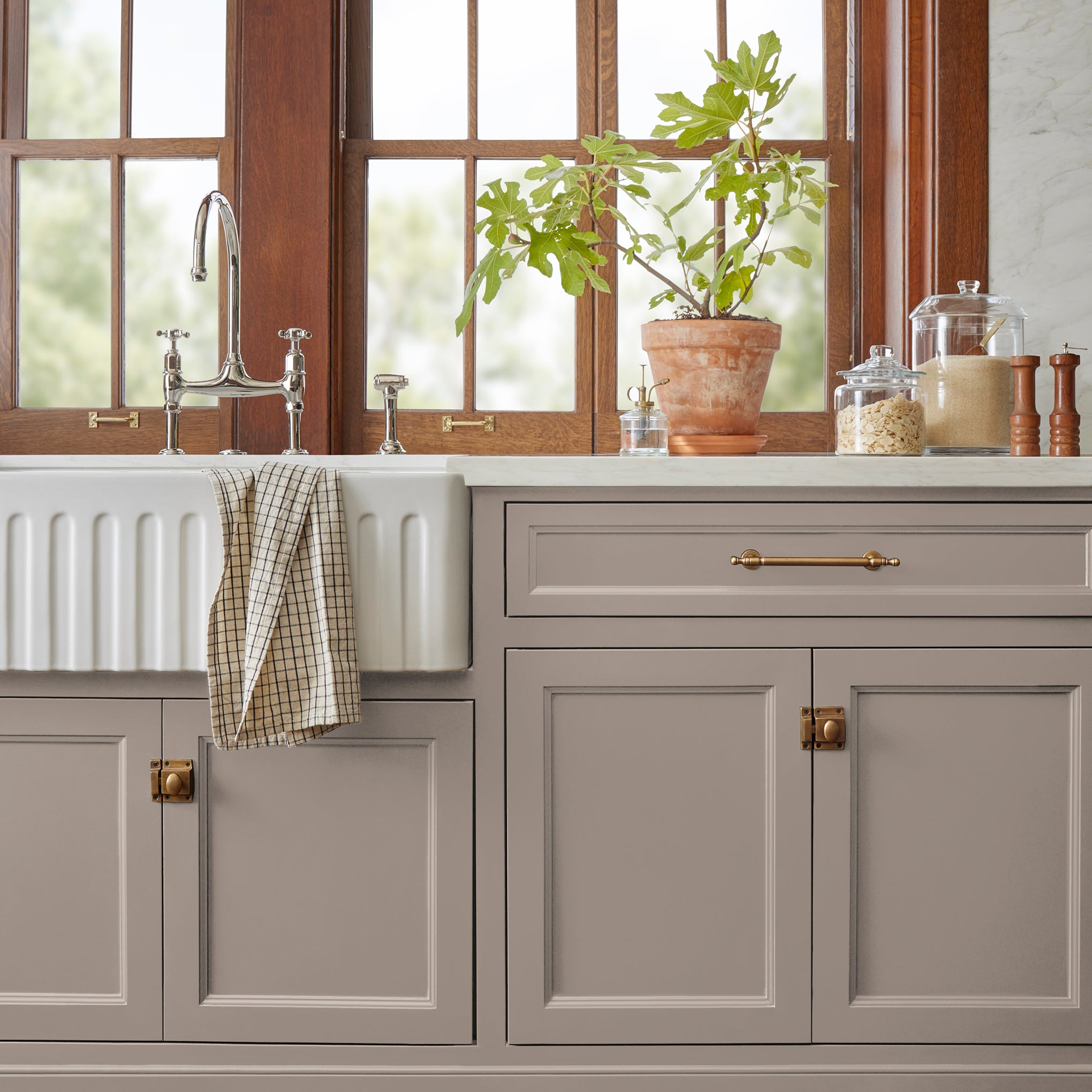 A taupe brown door and cabinet paint named antiquing shown painted on kitchen cabinet