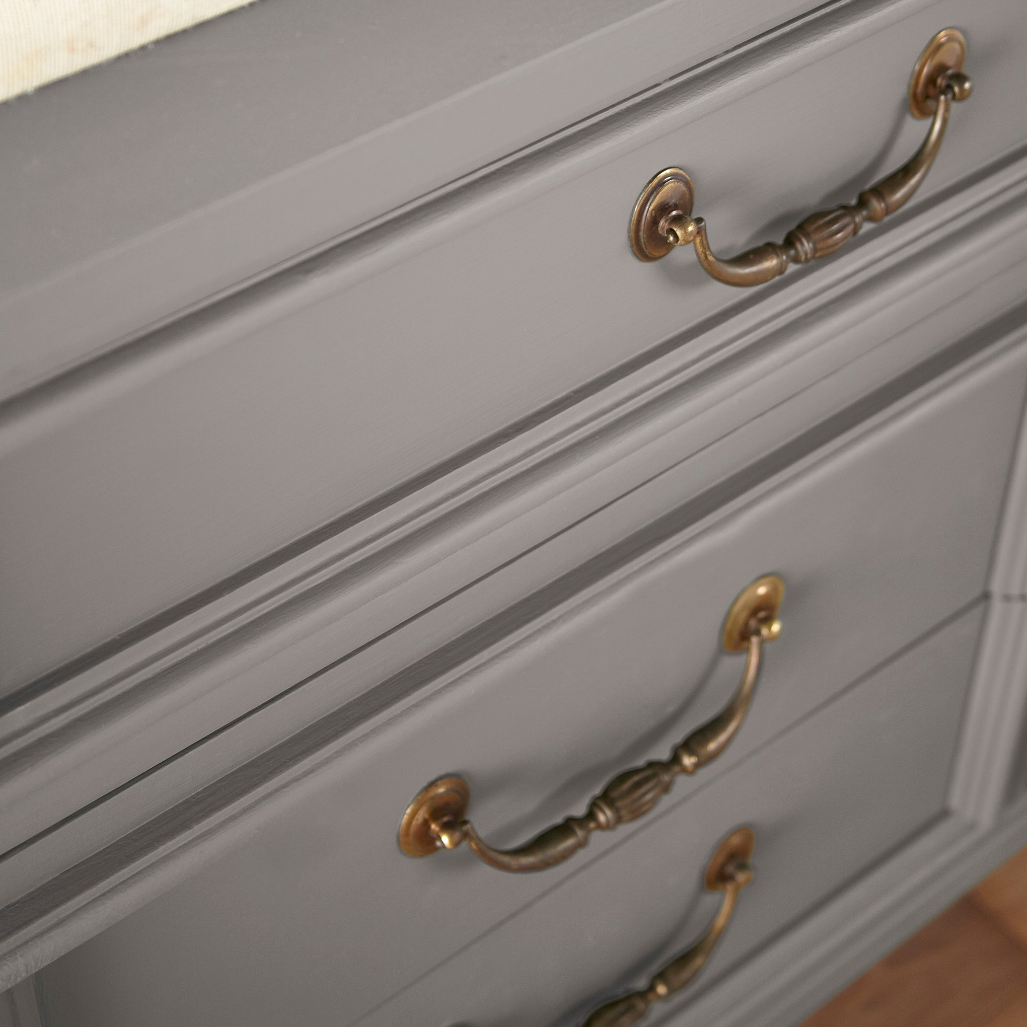 A mousy brown door and cabinet paint named wooden palette shown painted on cabinet