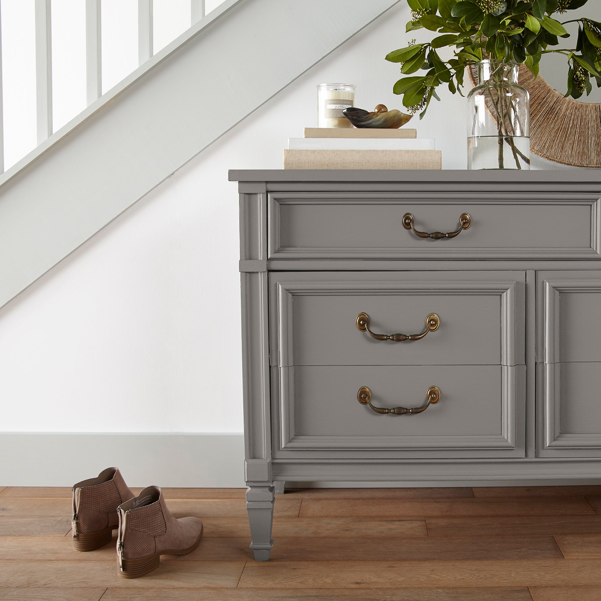 A mousy brown door and cabinet paint named wooden palette shown painted on entryway cabinet