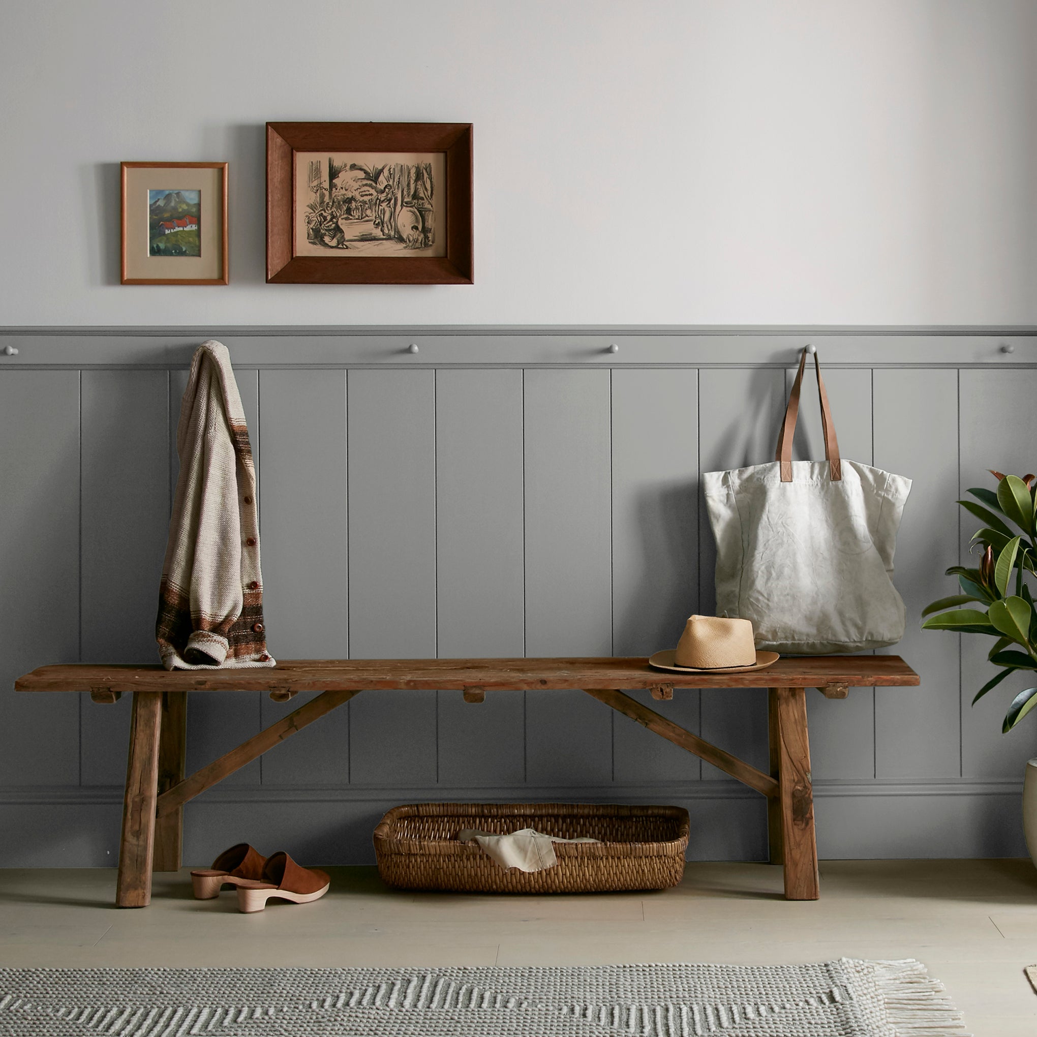 A warm mid-tone gray interior paint named cozy up shown painted on entryway wall