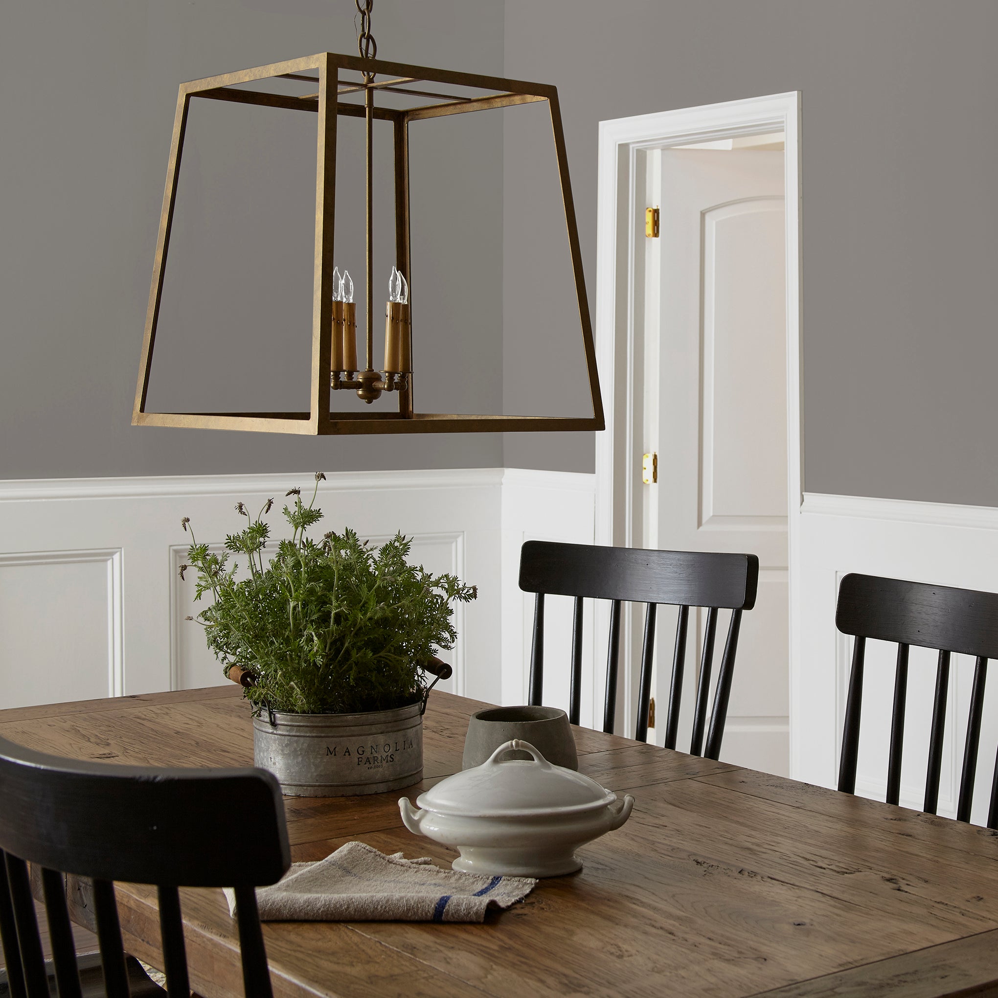 Smoky mid-toned brown interior paint named nesting box shown painted on dining room wall
