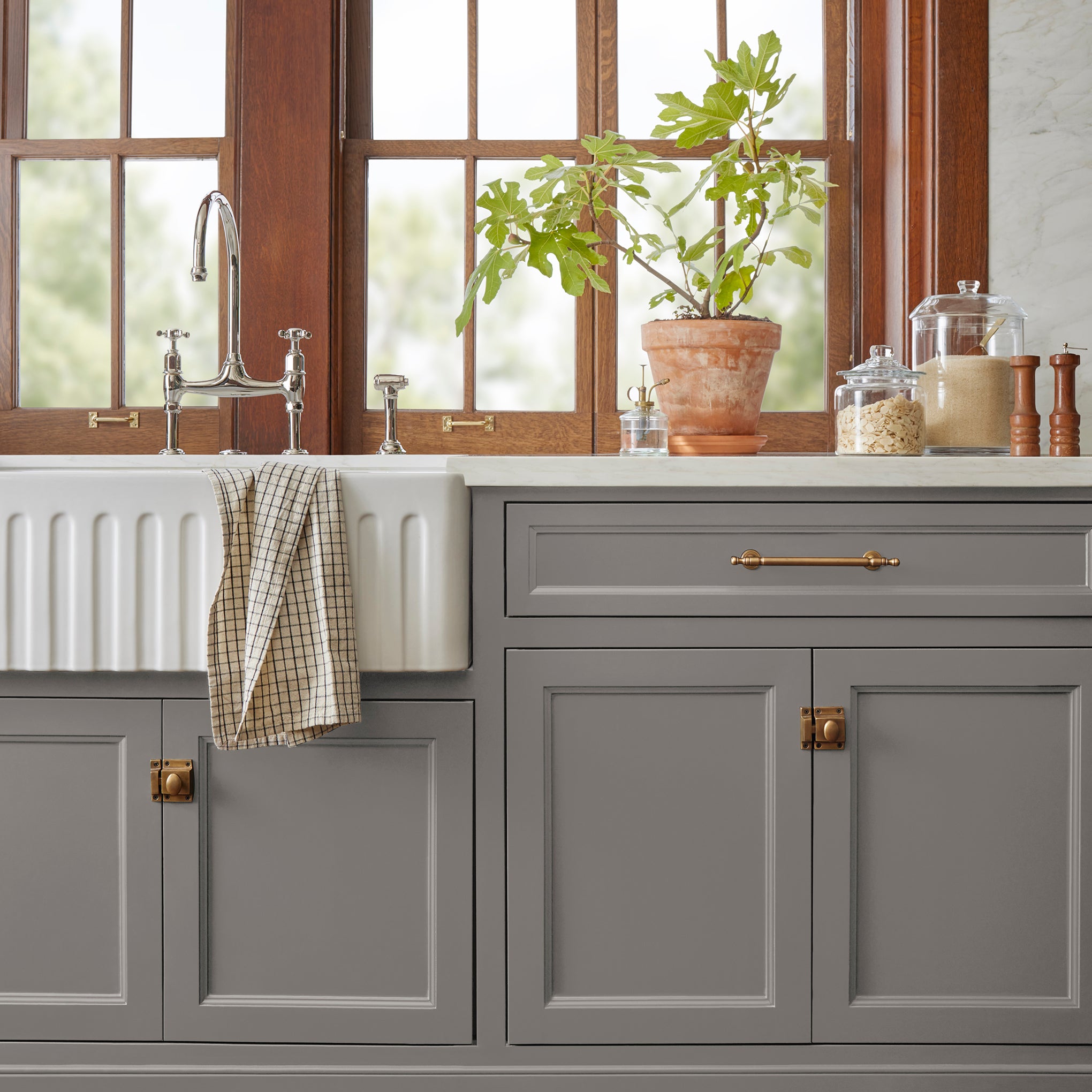 Smoky mid-toned brown door and cabinet paint named nesting box shown painted on kitchen cabinet