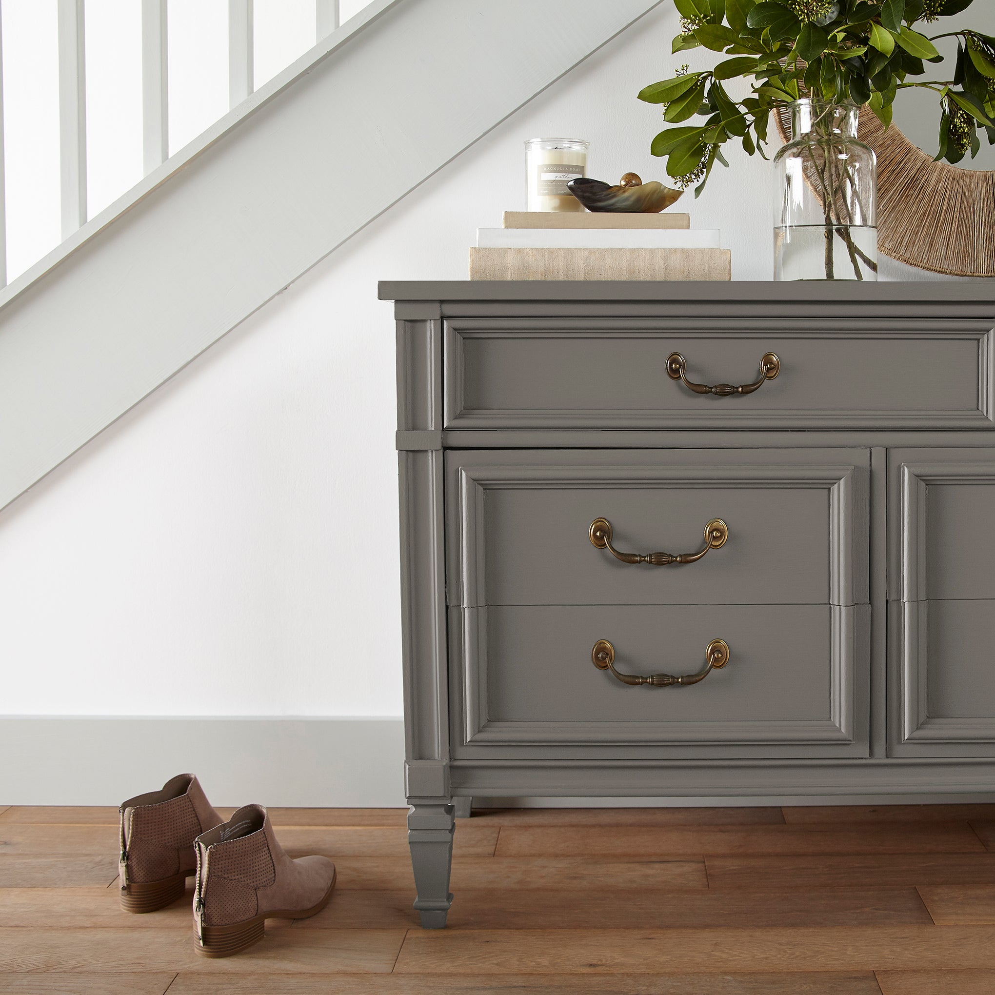 Rich earthy brown door and cabinet paint named rocking horse shown painted on entryway cabinet