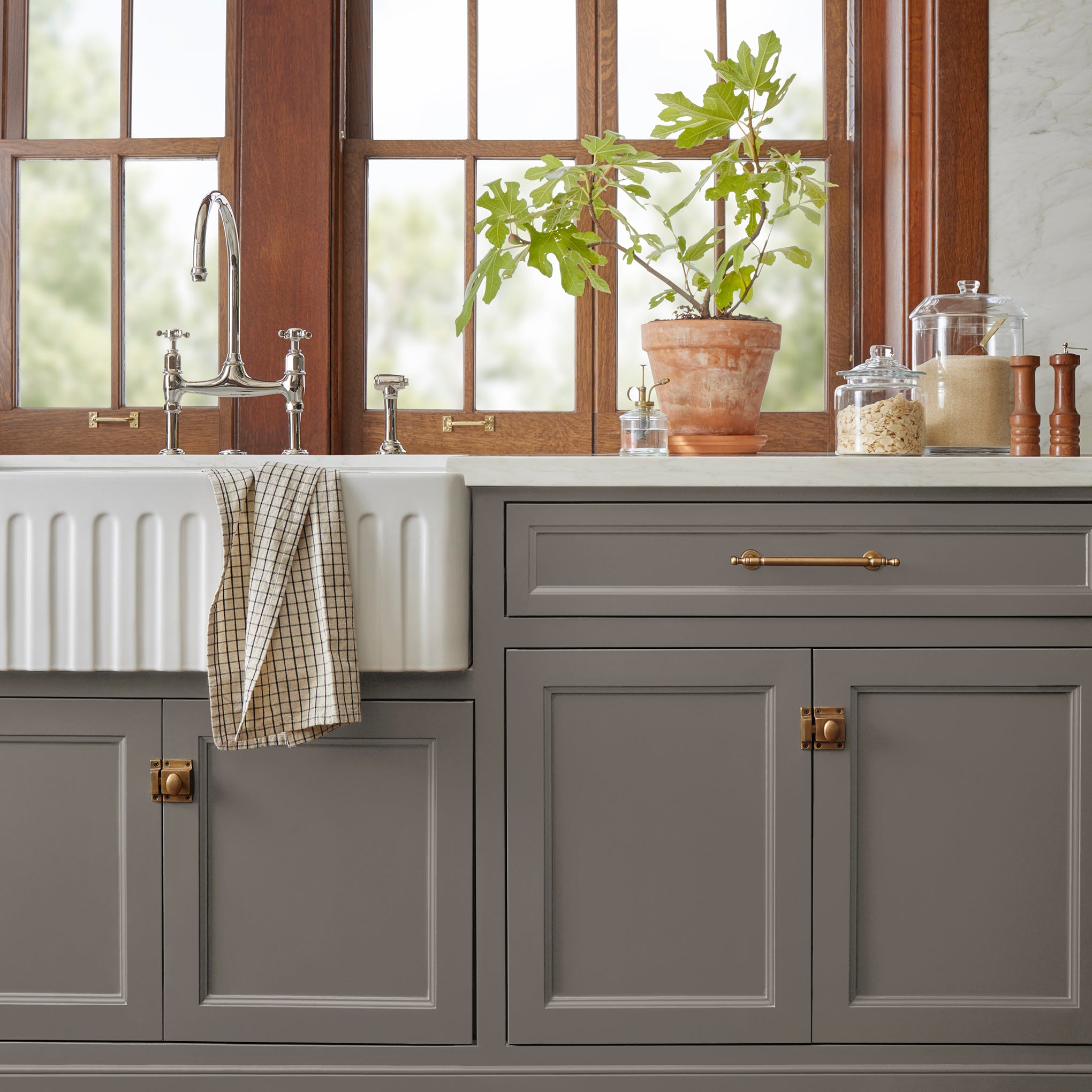 Rich earthy brown door and cabinet paint named rocking horse shown painted on kitchen cabinet