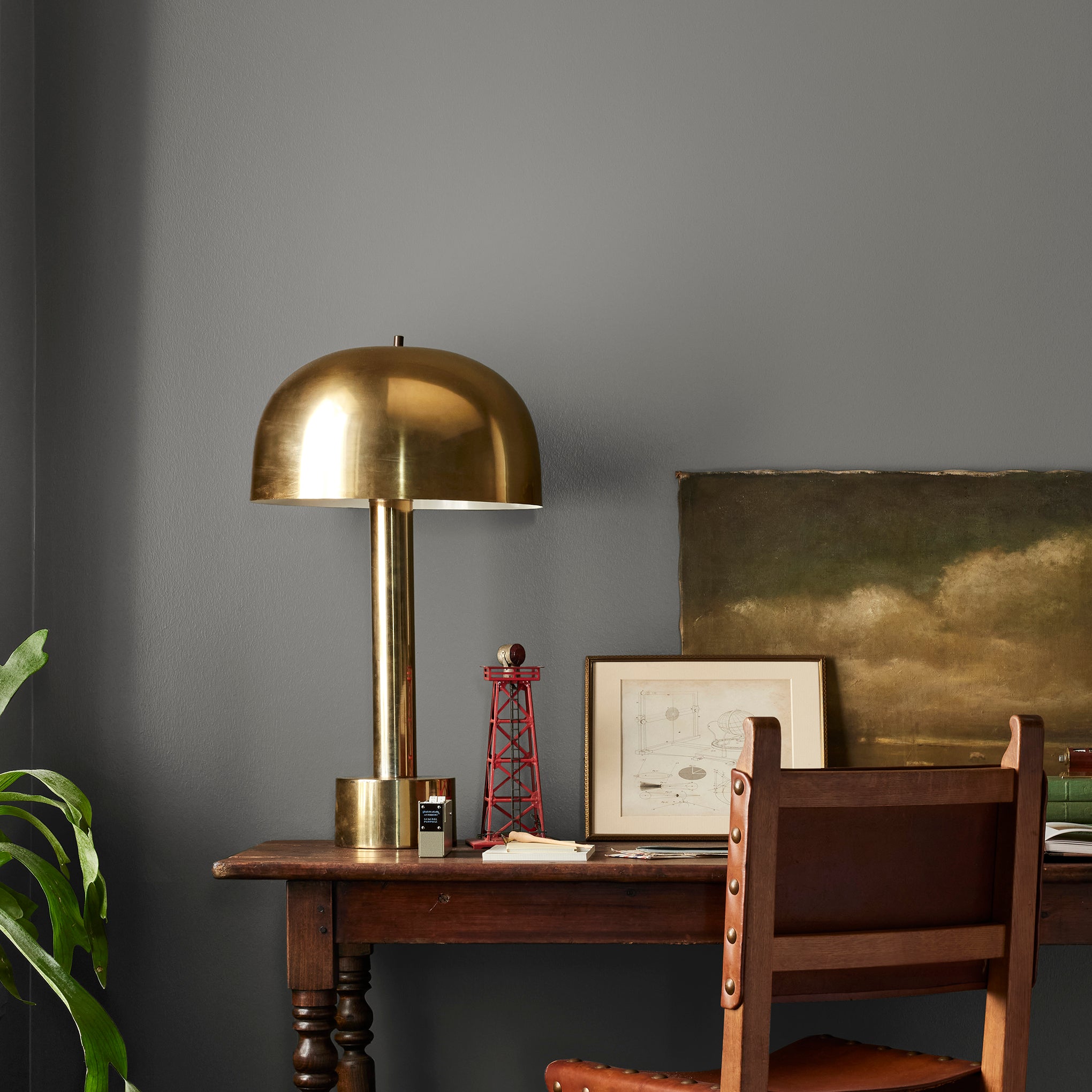 dark grey with brown undertone paint named salvaged shown painted on bedroom wall